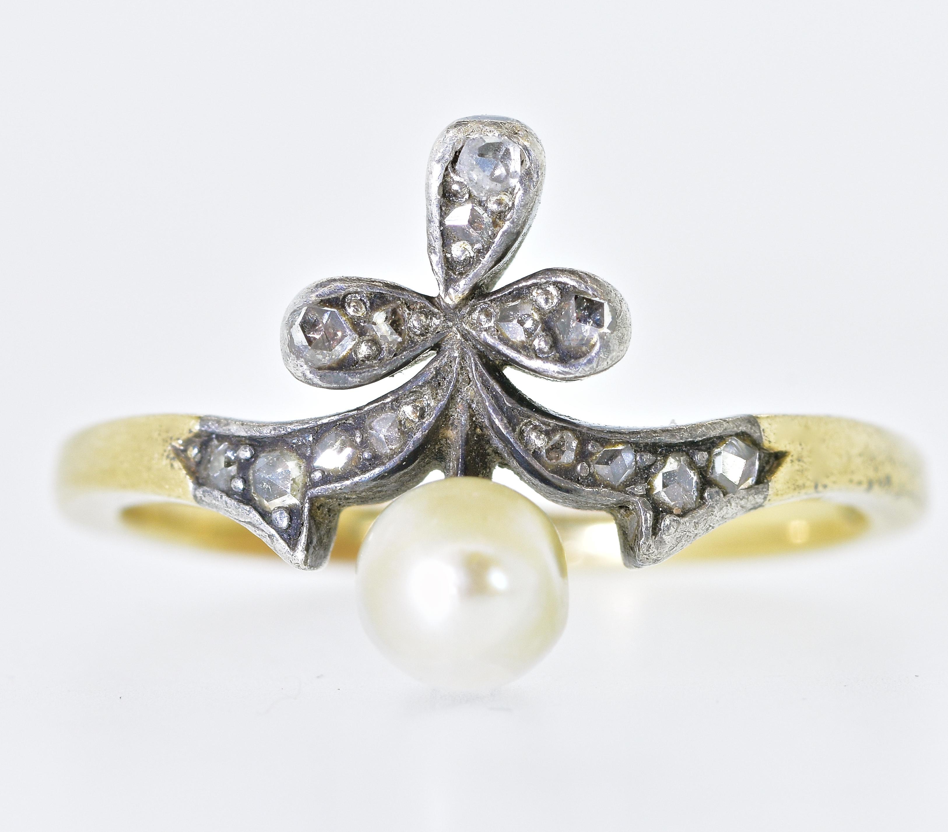 The pearl measures 4.83 mm., and is probably natural as opposed to cultured.  It is accented with rose cut diamonds set in silver.  This gold and silver ring dates to the mid 19th century .  In fine condition, this ring is a size 6.75