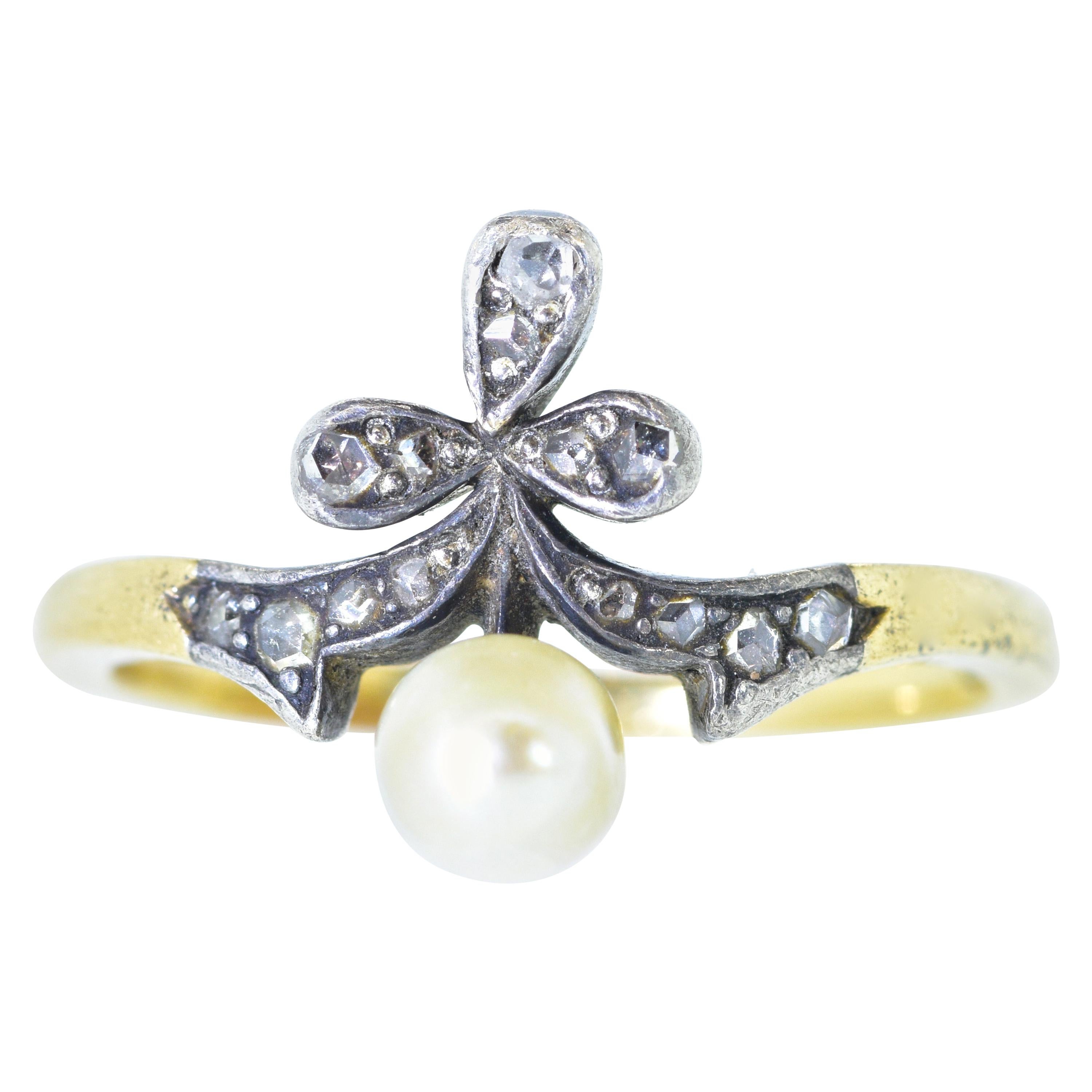 The pearl measures 4.83 mm., and is probably natural as opposed to cultured.  It is accented with rose cut diamonds set in silver.  This gold and silver ring dates to the mid 19th century .  In fine condition, this ring is a size 6.75.
 All items