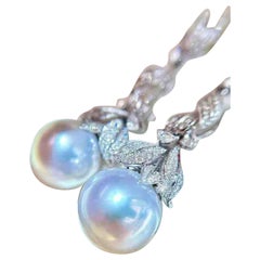 Orecchini con perle naturali e diamanti in oro bianco 18 carati