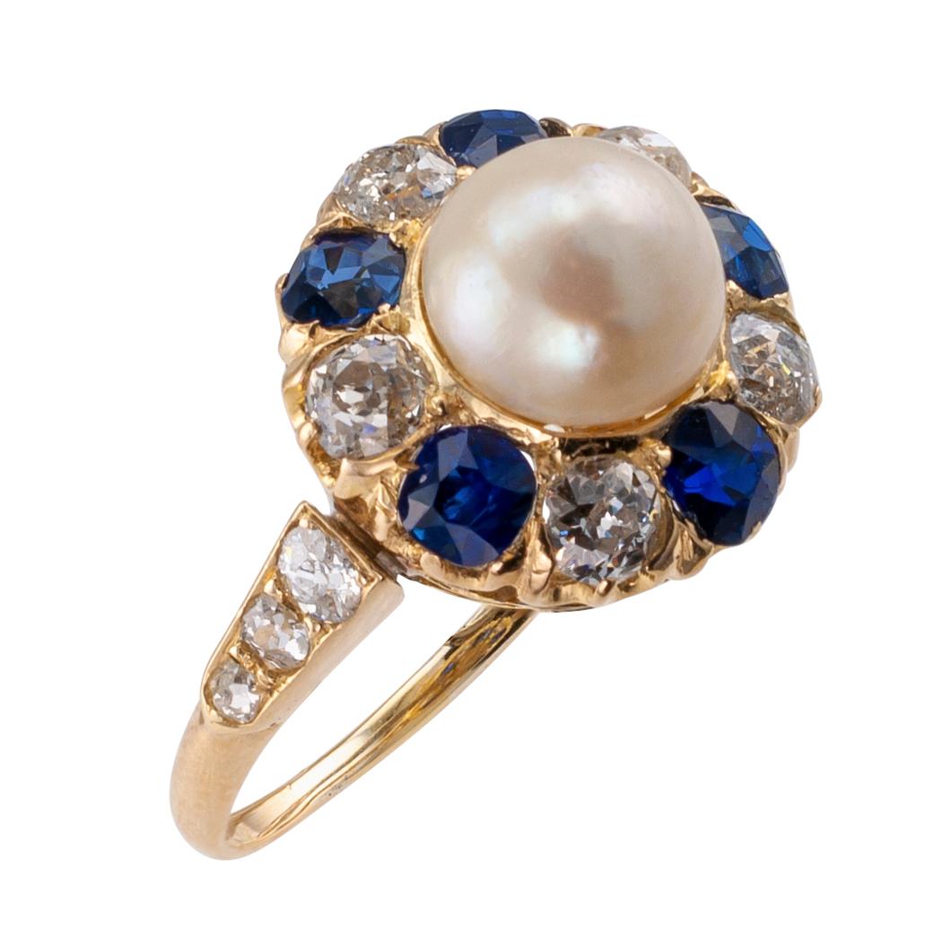 Natural pearl diamond sapphire and gold Victorian ring circa 1880. Centering upon a circular pearl, accompanied by a report from GIA stating that the pearl is a natural, salt water, white, button pearl 7.84 X 7.77 mm, set within a halo comprising