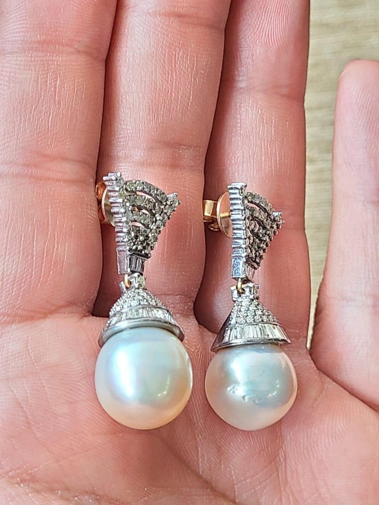 A very beautiful and wearable Pearl & Diamonds Art Deco style Victorian Drop/ Dangle Earrings set in 14K Gold & 925 Silver. The weight of the Pearl is 34.05 carats. The Pearl is a natural, fresh water South Sea Pearl. The combined weight of the