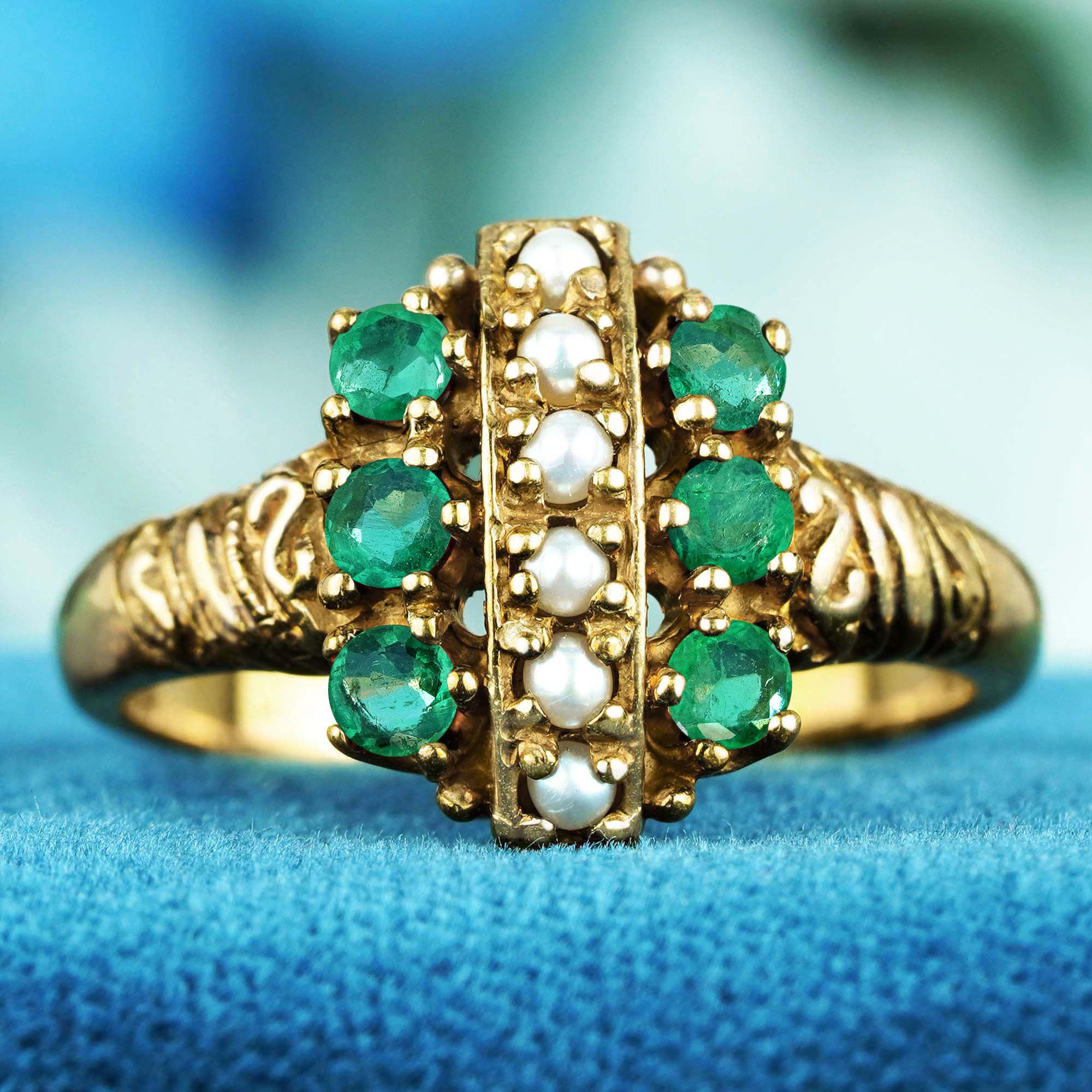 Introducing our Natural Pearl and Emerald Vintage Style Cluster Ring, where elegance meets timeless beauty. This exquisite ring features a stunning vertical arrangement of lustrous natural pearls, accentuated by vibrant emeralds flanking both sides.