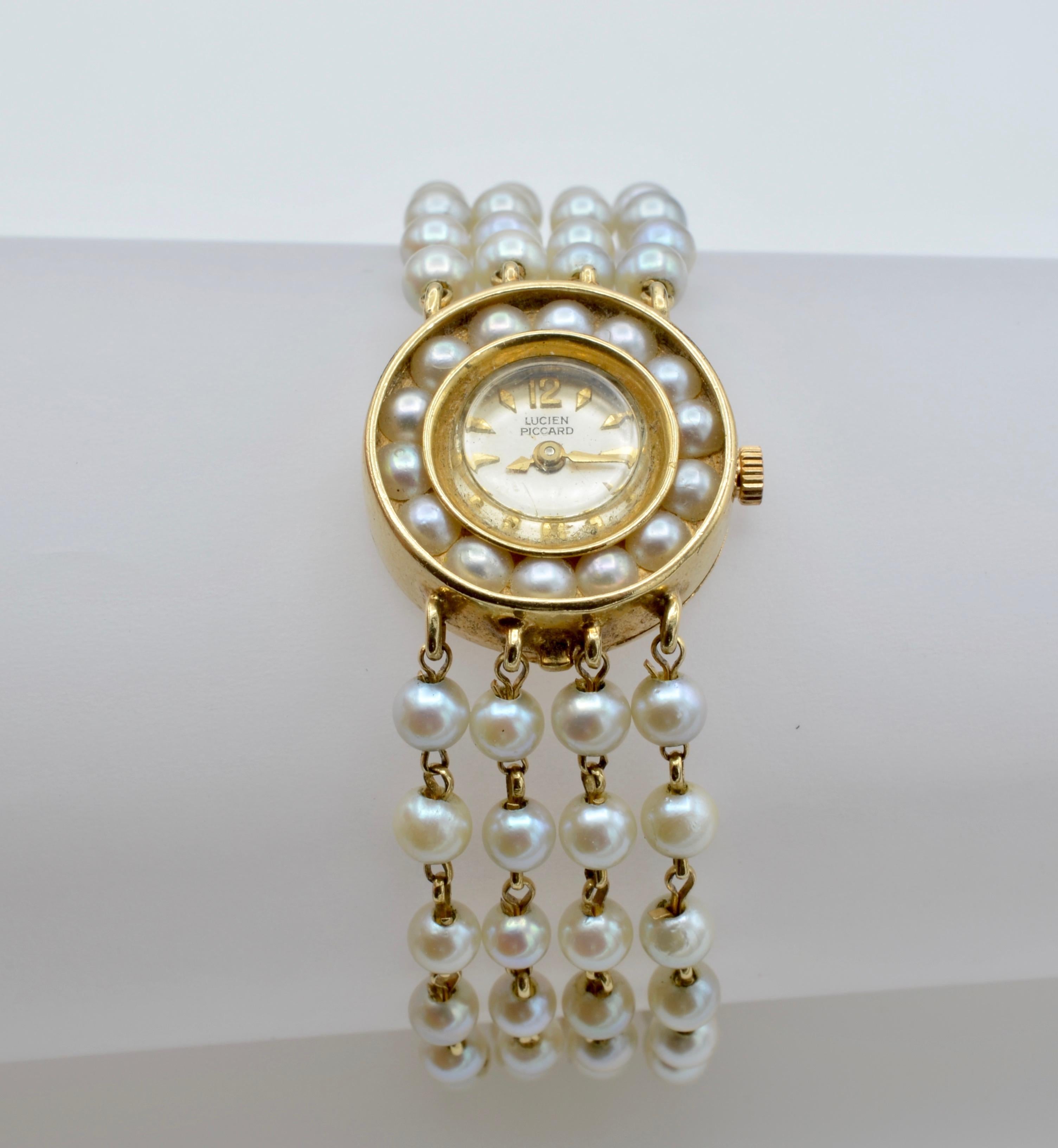 This lovely Lady watch bracelet is four strands of freshwater pearls hand wrapped in 14k with a watch face embedded with pearls. The clasp is beautifully designed with a safety chain. This is a great watch to layer with other bracelets for a casual