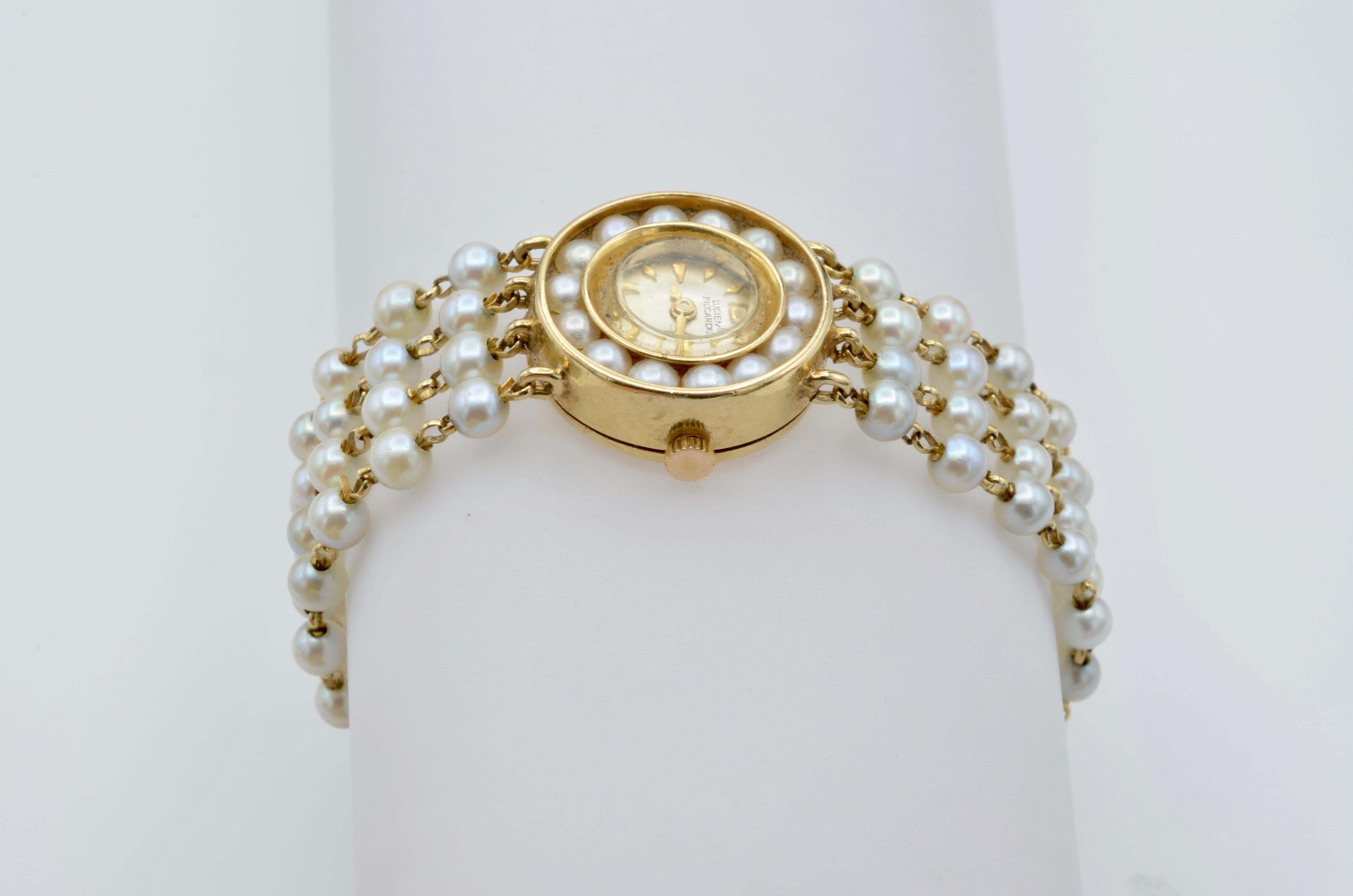 gold and pearl watch