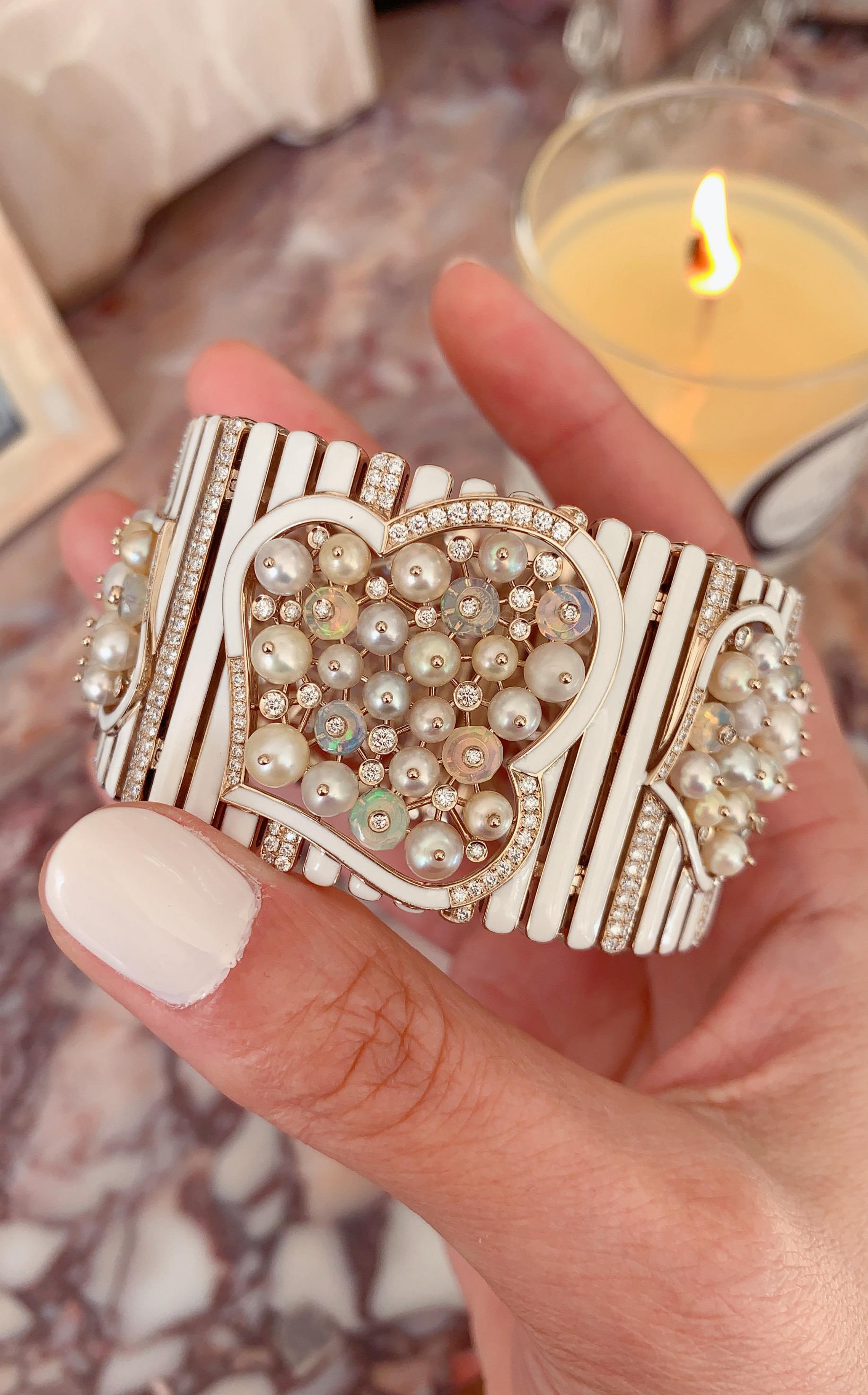 A Natural Pearl, Opal, Diamond and Enamel Gold Cuff as part of the Selene Suite by Jewelry Designer, Sarah Ho.

The Selene pieces capture the luminescent beauty of the natural pearls - these pearls range in color from apricot to lavender - an