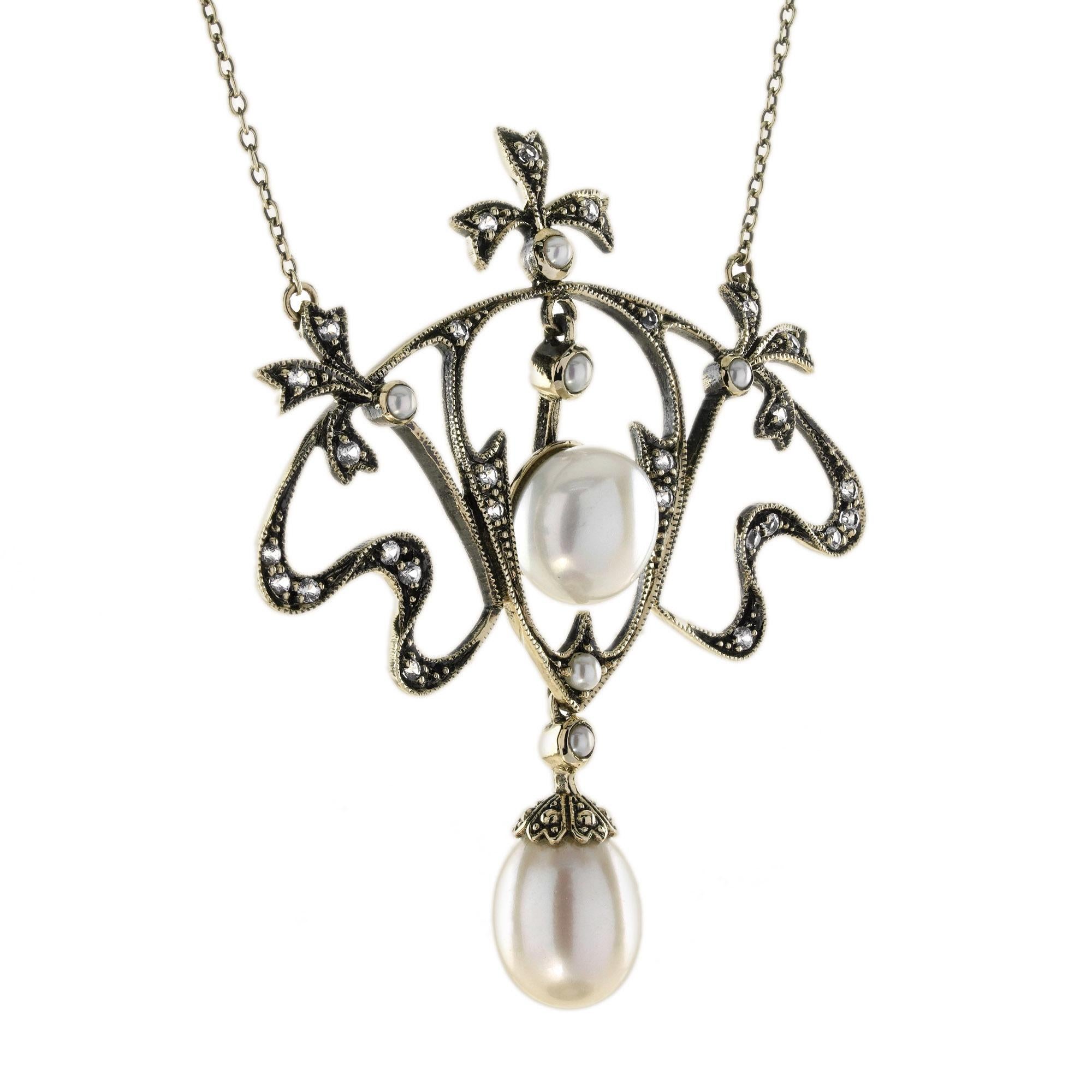 This elegant vintage Victorian style necklace features a lustrous pearl at the center of a beautifully crafted floral design. The floral motif is further enhanced by a graceful drop of sparkling white sapphire, adding an extra touch of brilliance.