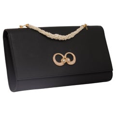 Natural Pearls Genuine Leather Clutch in 18k Yellow gold with Diamonds