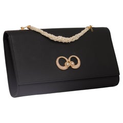 Natural Pearls Genuine Leather Clutch in 18k Yellow gold with Diamonds