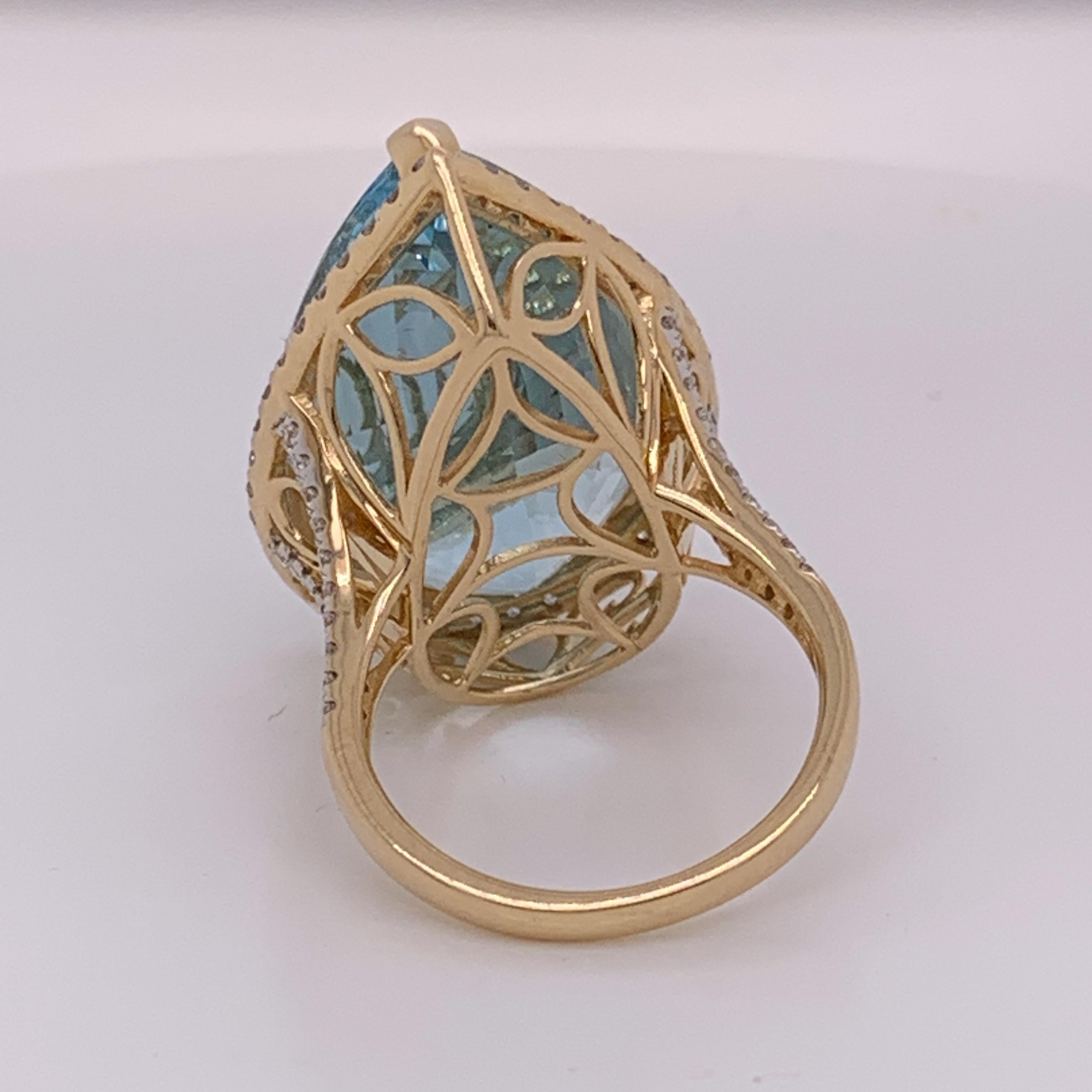 Natural Pears shape 26.71 Aquamarine and 0.90 Carat White diamonds set in 14 Karat yellow gold is one of a kind handcrafted Ring. The ring is currently size 7 . If needed the ring can be resized.
The stone is clean with out inclusion and very good