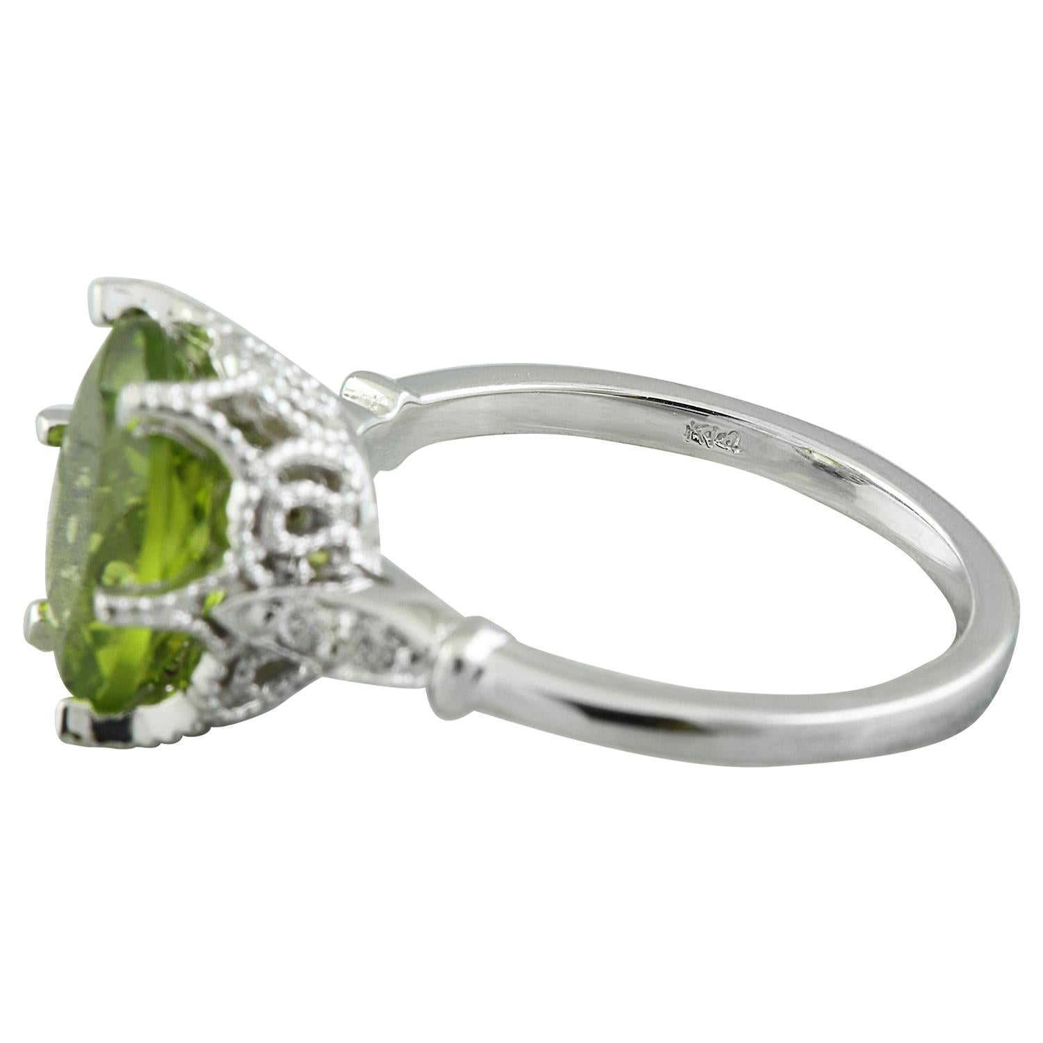 3.41 Carat Natural Peridot 14 Karat Solid White Gold Diamond Ring
Stamped: 14K 
Total Ring Weight: 4.2 Grams 
Peridot Weight: 3.26 Carat (11.00x9.00 Millimeters)  
Diamond Weight: 0.15 carat (F-G Color, VS2-SI1 Clarity )
Quantity: 4
Face Measures: