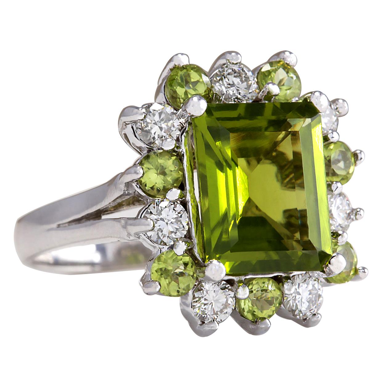 Indulge in the natural beauty of our 4.97 Carat Natural Peridot 14 Karat White Gold Diamond Ring. Crafted with exquisite attention to detail, this ring is a true testament to luxury and sophistication.

The centerpiece of this stunning ring is a