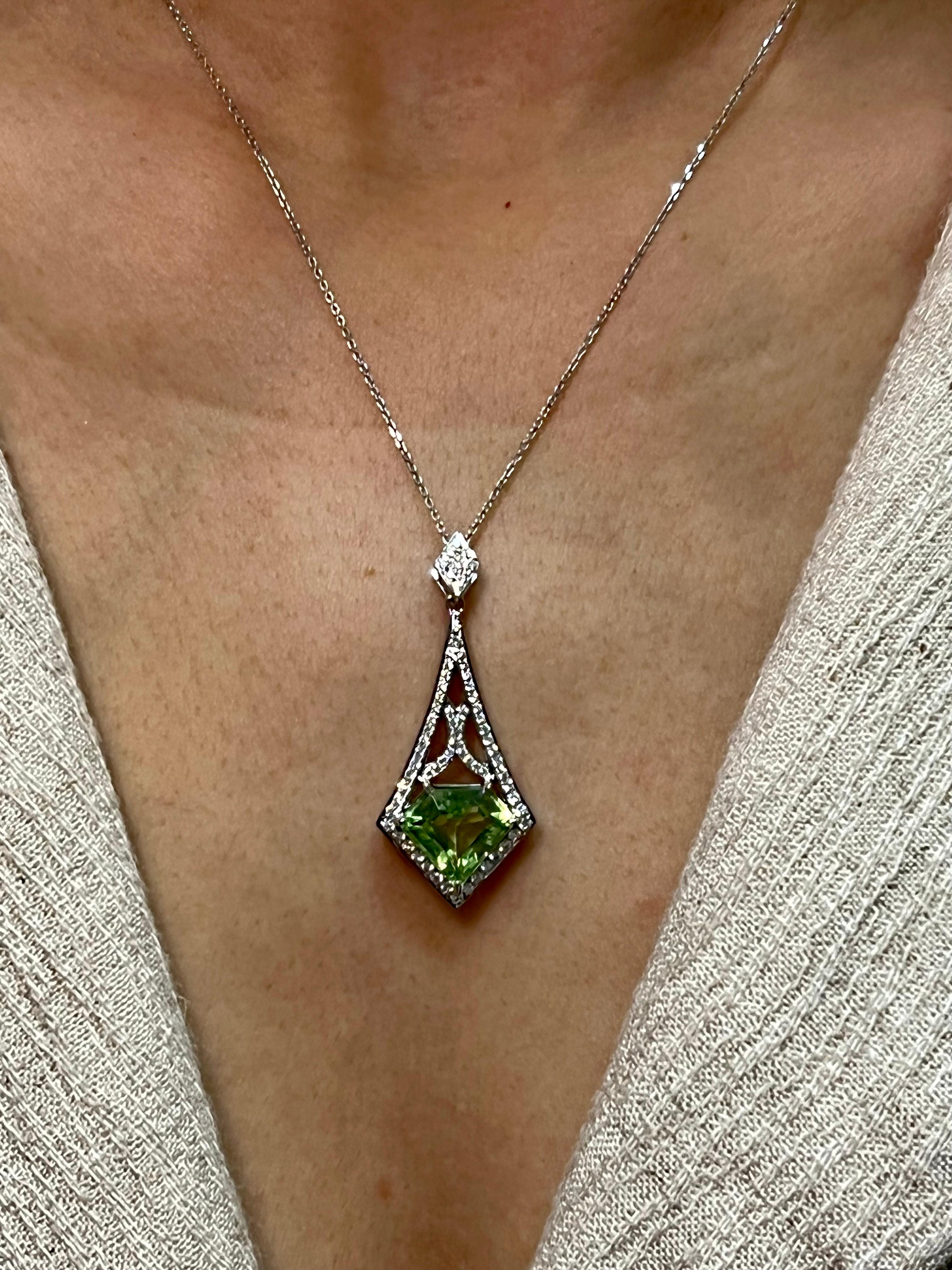 Please check out the HD video. This is a versatile piece of jewelry made with a top notch gem peridot. You can wear this pendant dressed up or down. The green peridot pendant is made of 18k white gold and diamonds. There is one larger natural