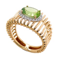 Anello con gabbia di diamanti e peridoto naturale in oro 18 carati