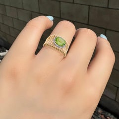 Anello con gabbia di diamanti e peridoto naturale in oro 18 carati