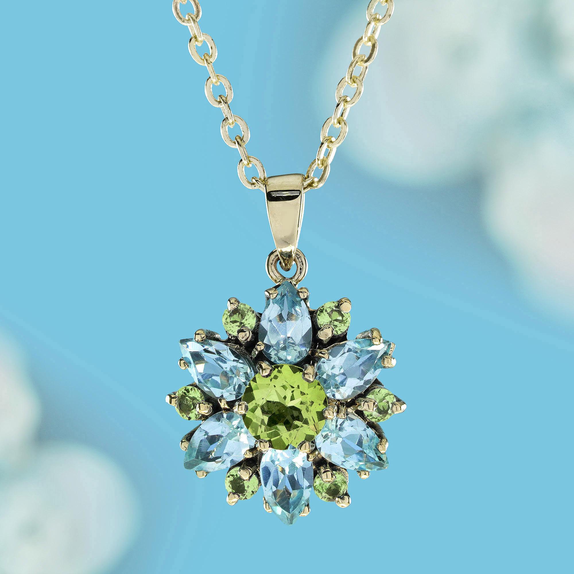 Embrace the beauty of nature with our natural peridot blue topaz vintage style flower pendant in 9k yellow gold. This exquisite pendant showcases a vibrant floral design, featuring natural peridot and stunning blue topaz that blooms beautifully in a