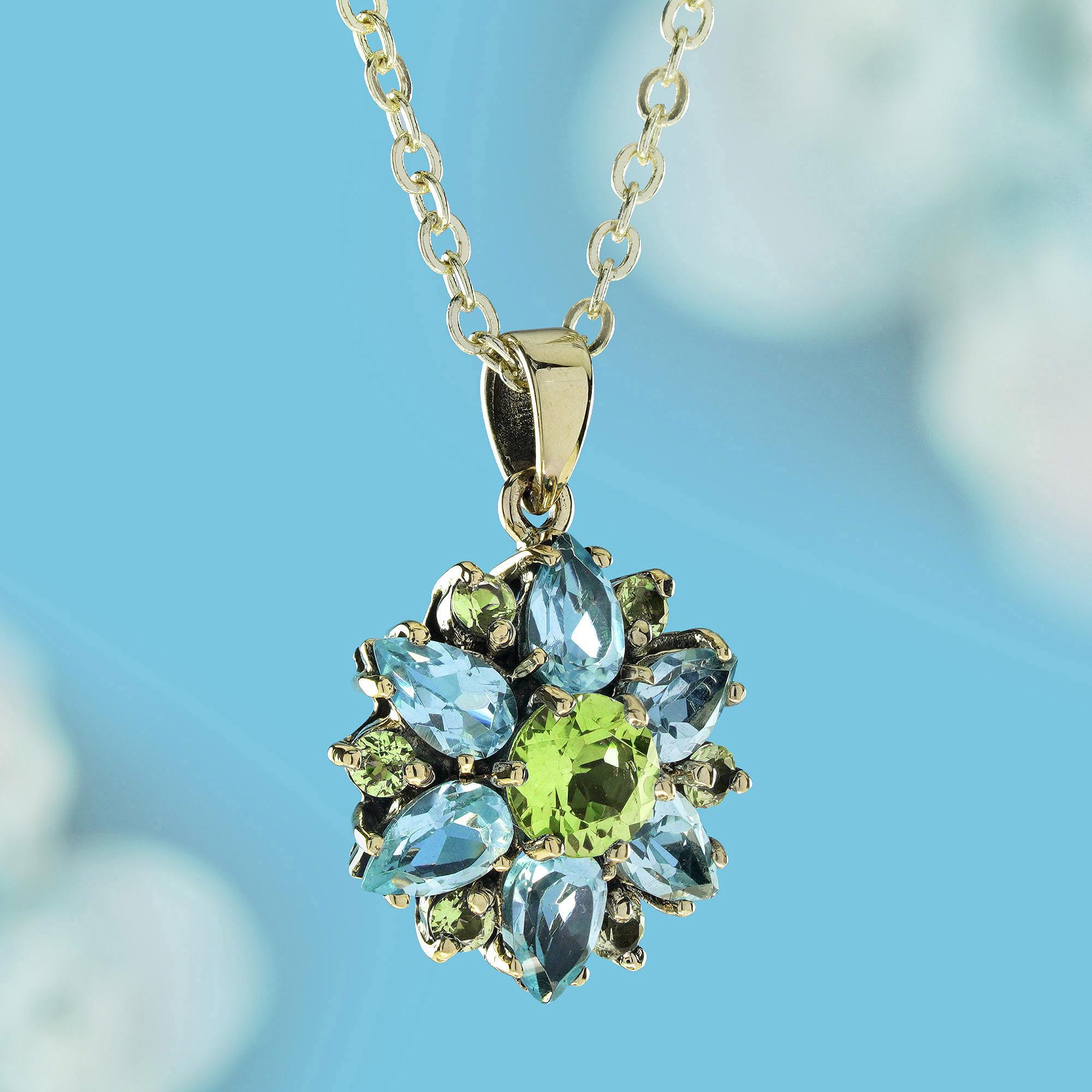 Edwardian Natural Peridot Blue Topaz Vintage Style Flower Bloom Pendant in 9K Yellow Gold For Sale