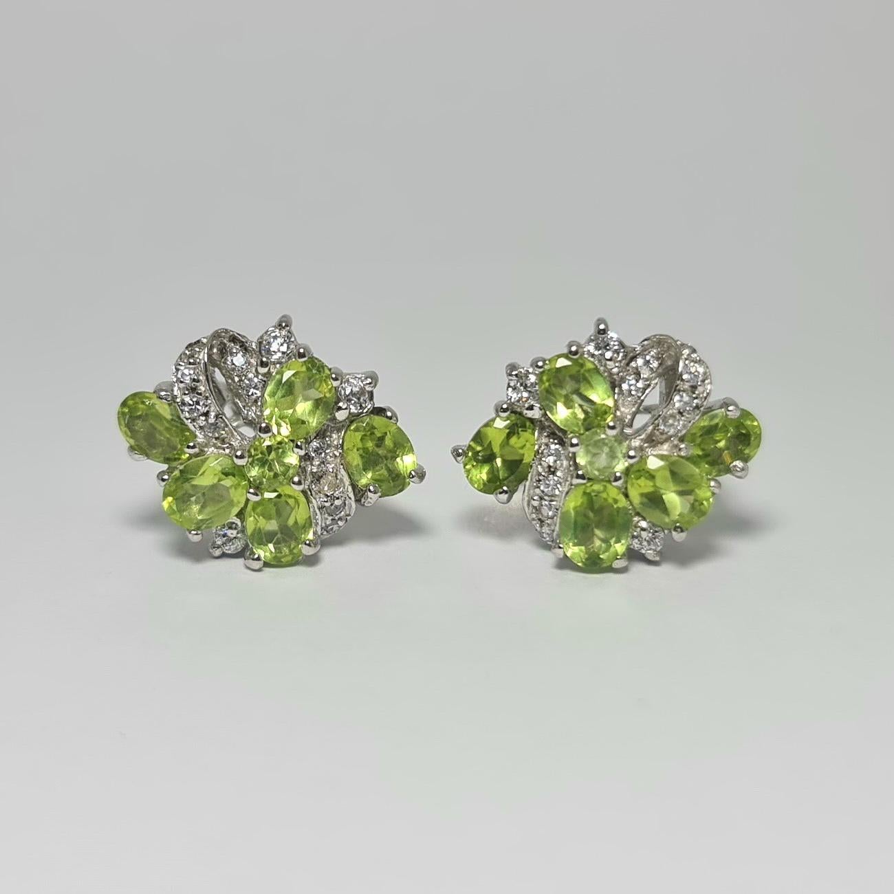 Natural Peridot and Cubic Zirconia in Pure .925 Sterling Silver Rhodium Plated Earrings ,
Please see other listings for matching ring and pendant 