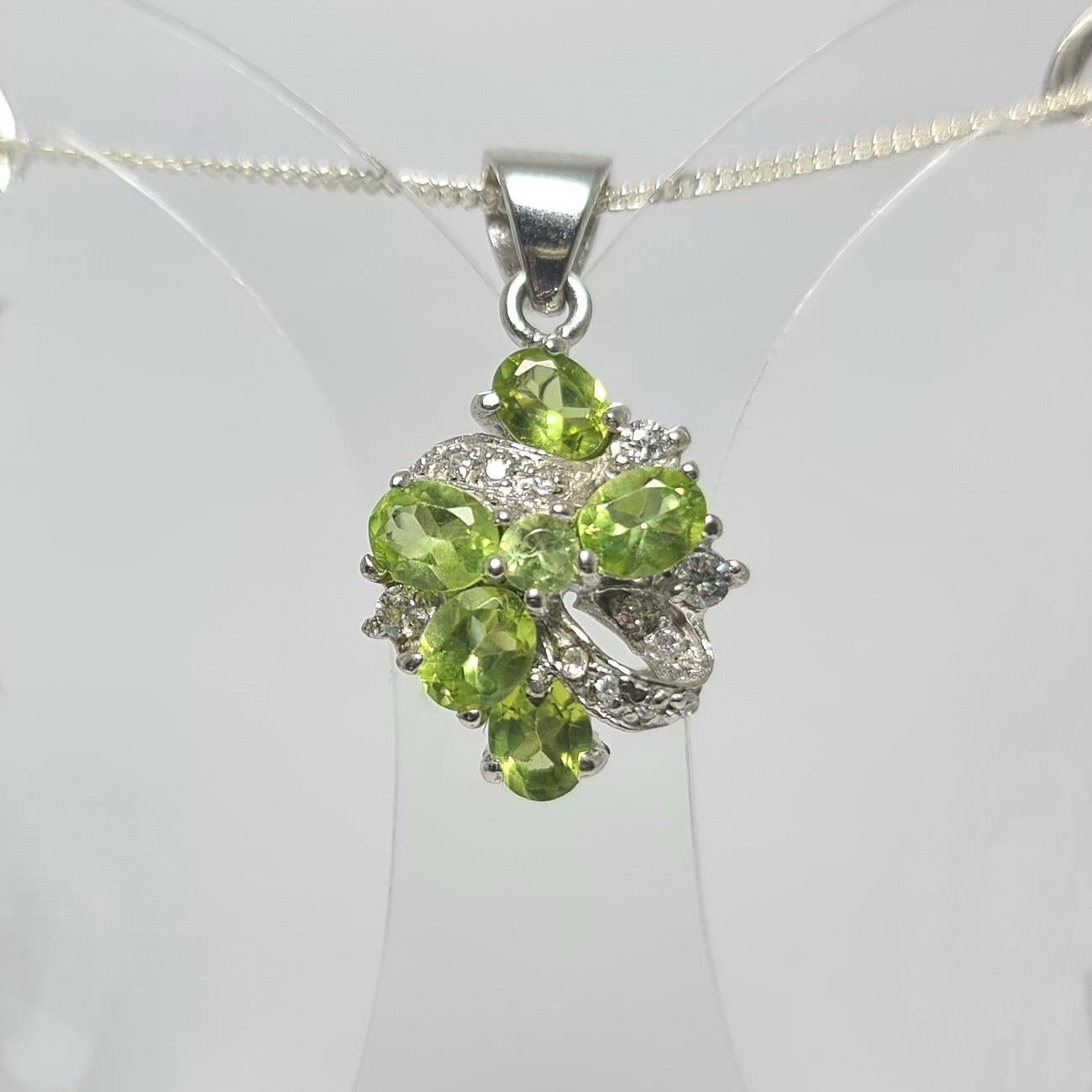 Natural Peridot and cubic zirconia in pure .925 Sterling Silver Pendant

Please see other listings for matching pieces 
