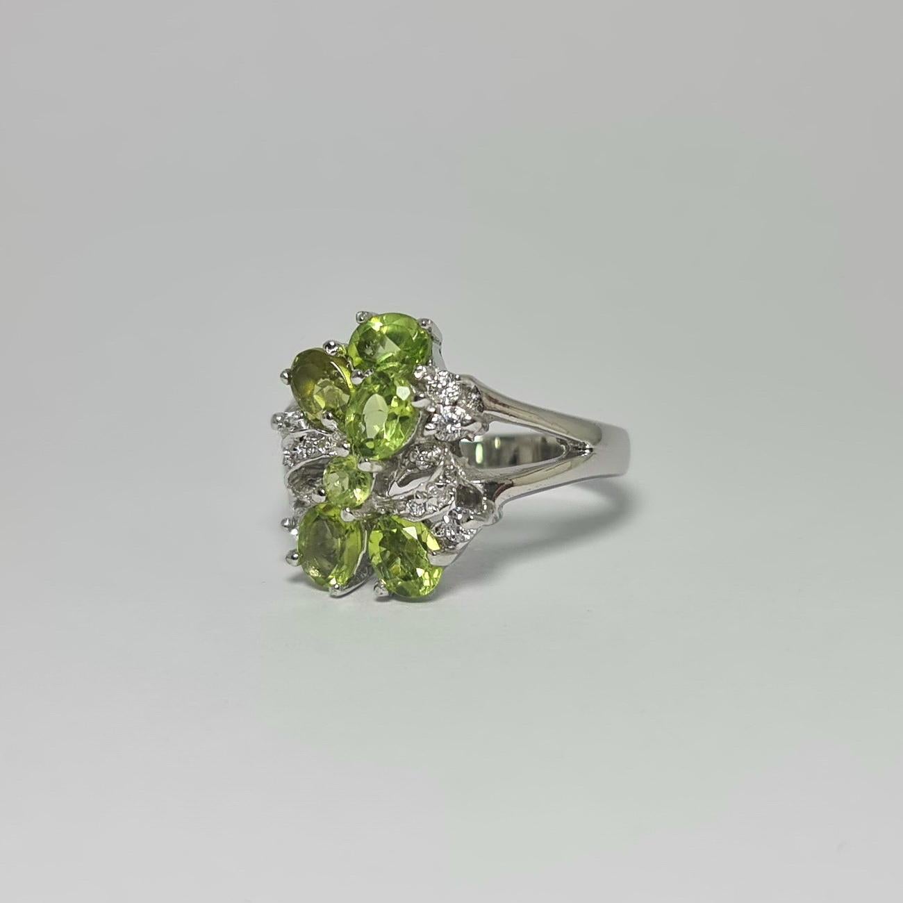 Natural Peridot with Cubic Zirconia  in .925  Pure Sterling Silver Rhodium Plated  Ring
Please see other listings for matching pieces 