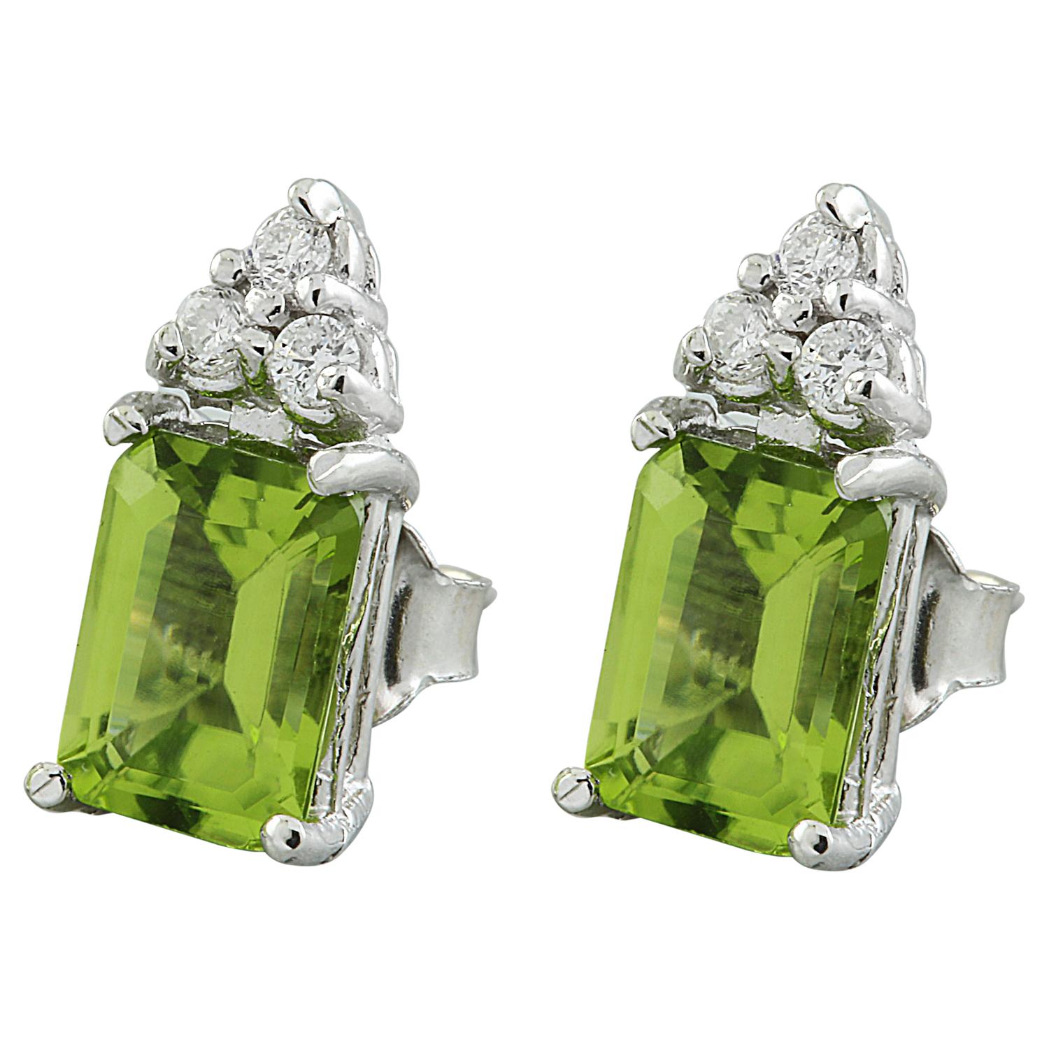 2.65 Carat Natural Peridot 14 Karat Solid White Gold Diamond Earrings
Stamped: 14K 
Total Earrings Weight: 1.5 Grams 
Peridot Weight: 2.50 Carat (7.00x5.00 Millimeters)  
Diamond Weight: 0.15 Carat (F-G Color, VS2-SI1 Clarity )
Face Measures: