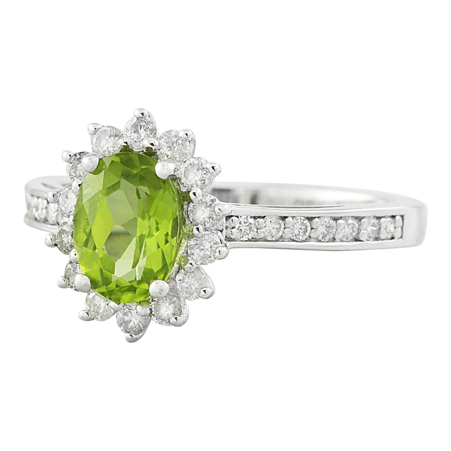 Discover elegance with our 14K Solid White Gold Diamond Ring, featuring a captivating 1.95 Carat Natural Peridot. This exquisite piece is stamped with 14K authenticity, guaranteeing its quality craftsmanship. With a total weight of 2.8 grams, this