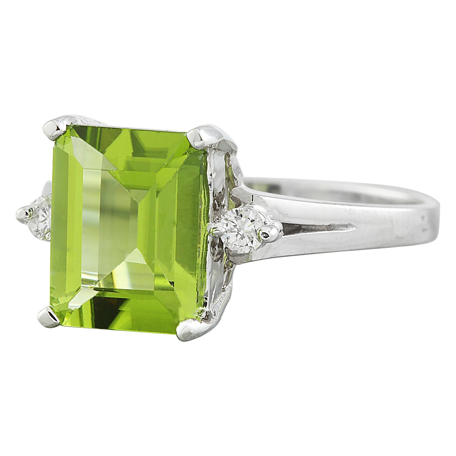 2.26 Carat Natural Peridot 14 Karat Solid White Gold Diamond Ring
Stamped: 14K 
Stamped: 14K 
Ring Size 7
Total Ring Weight: 2.9 Grams 
Peridot Weight 2.20 Carat (9.00x7.00 Millimeters)
Natural Peridot Treatment: Heating Only
Diamond Weight: 0.06