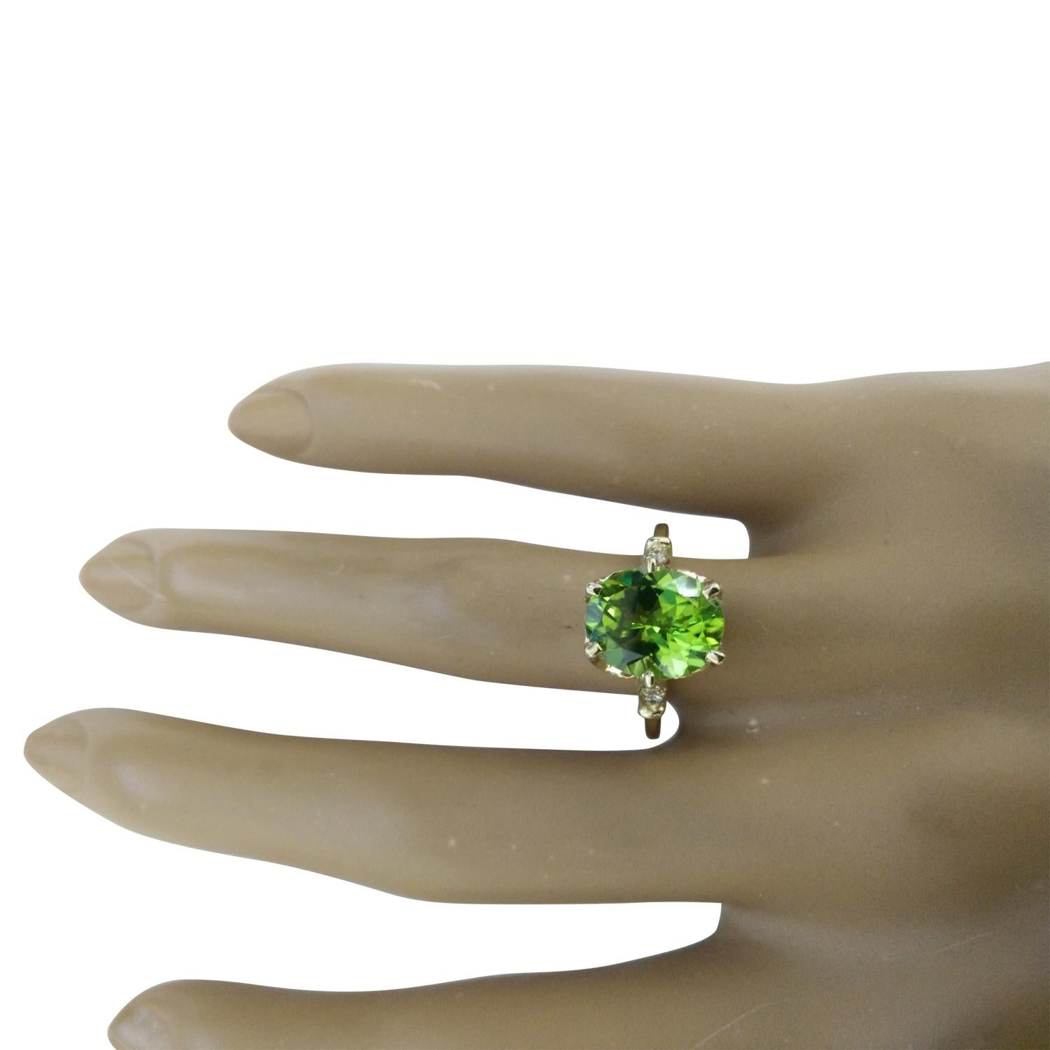 3.41 Carat Natural Peridot 14 Karat Solid Yellow Gold Diamond Ring
Stamped: 14K
Total Ring Weight: 4.2 Grams 
Peridot Weight: 3.26 Carat (11.00x9.00 Millimeters)  
Diamond Weight: 0.15 Carat (F-G Color, VS2-SI1 Clarity)
Quantity: 4
Face Measures:
