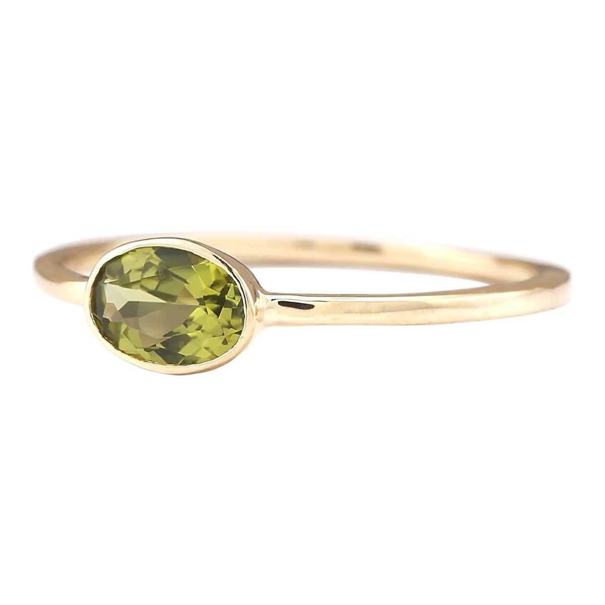 Introducing our exquisite 14 Karat Yellow Gold Ring featuring a stunning 0.60 Carat Natural Peridot gemstone. Stamped for authenticity, this ring weighs a mere 1.0 gram, ensuring comfort and wearability. The Peridot gemstone, boasting a weight of