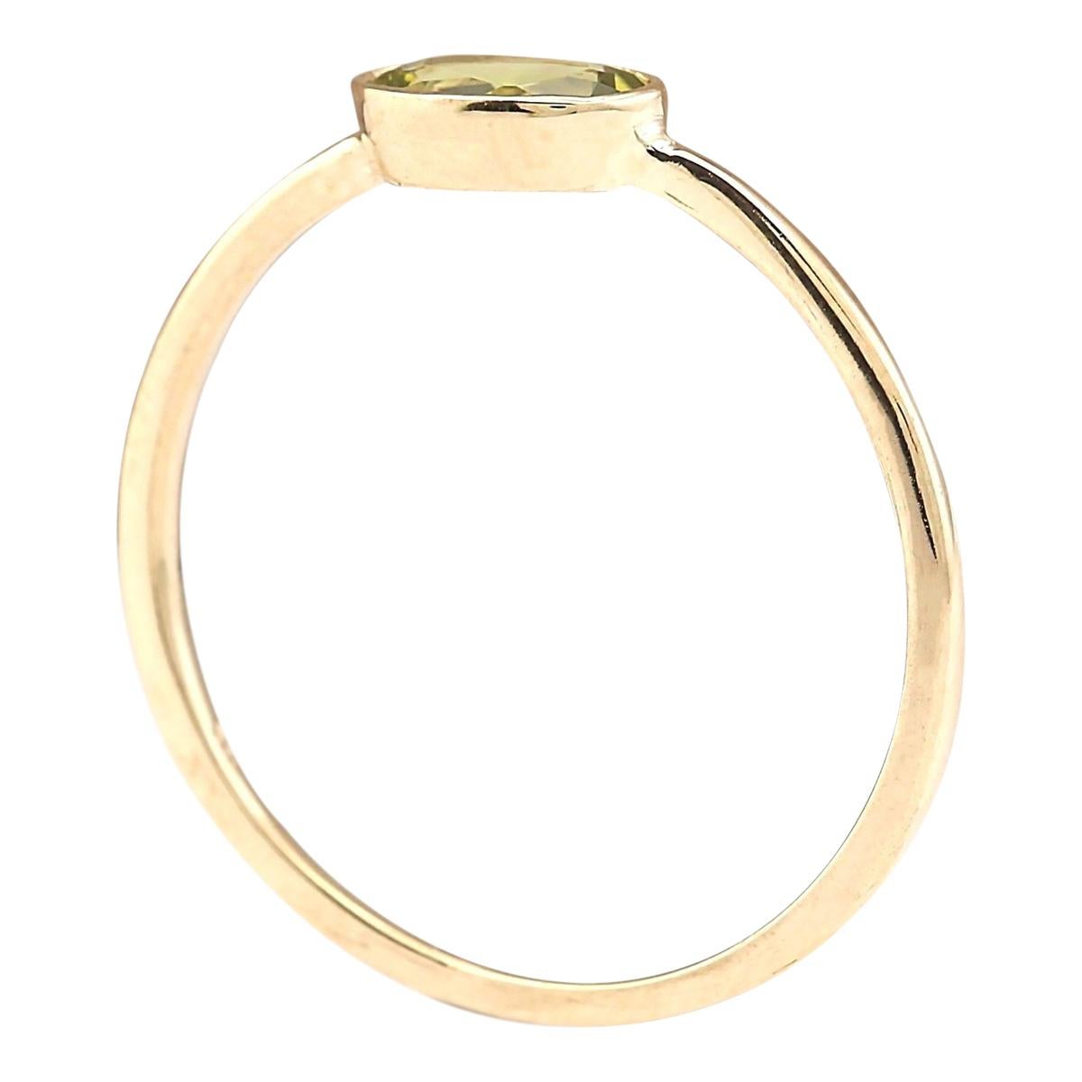 Modern Natural Peridot Ring In 14 Karat Yellow Gold  For Sale