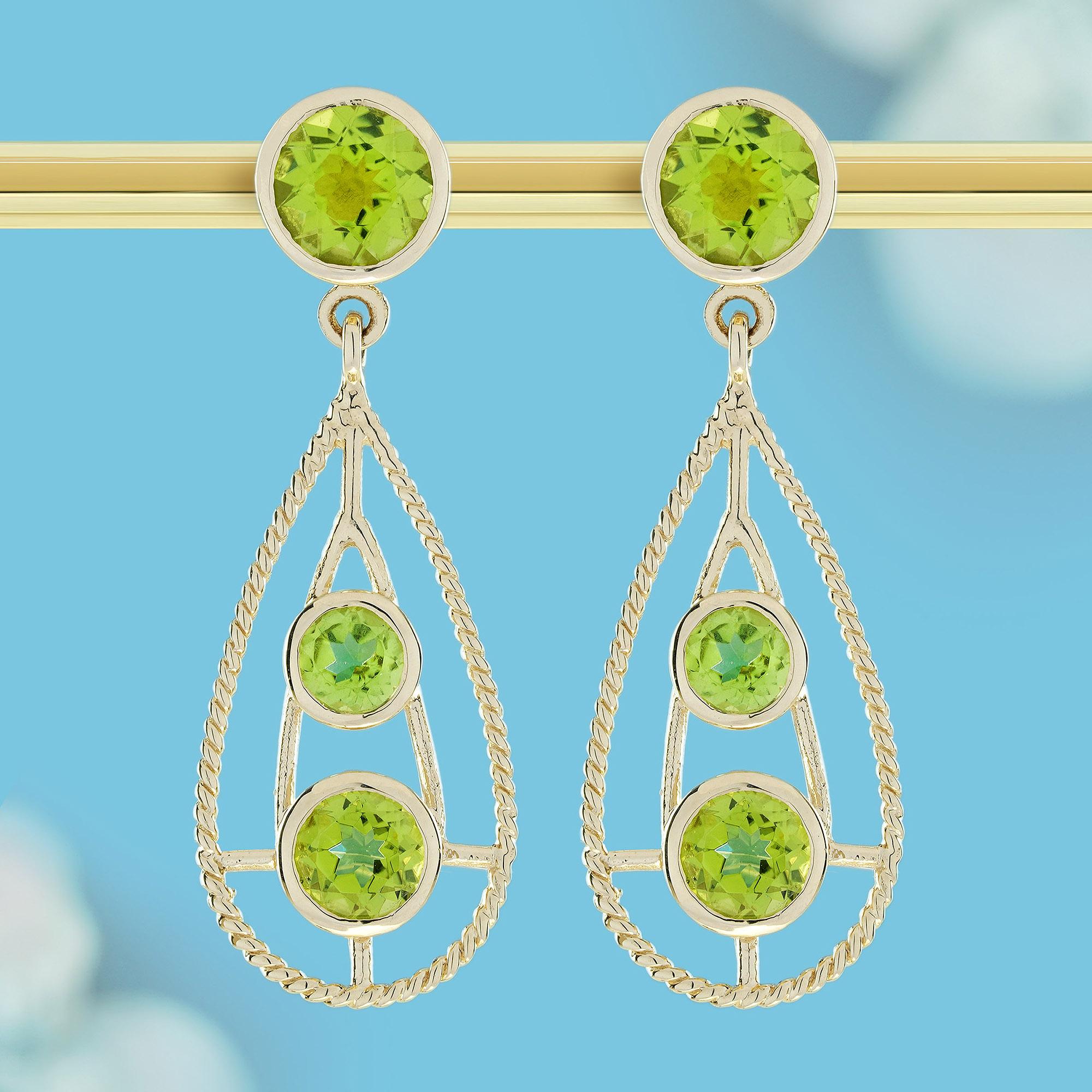 Radiating sophistication, these exquisite teardrop earrings adorned by three perfectly matched peridots in sublime shades of lime green, arranged in descending order to create a graceful gradient effect. The largest gemstone serves as the anchor at