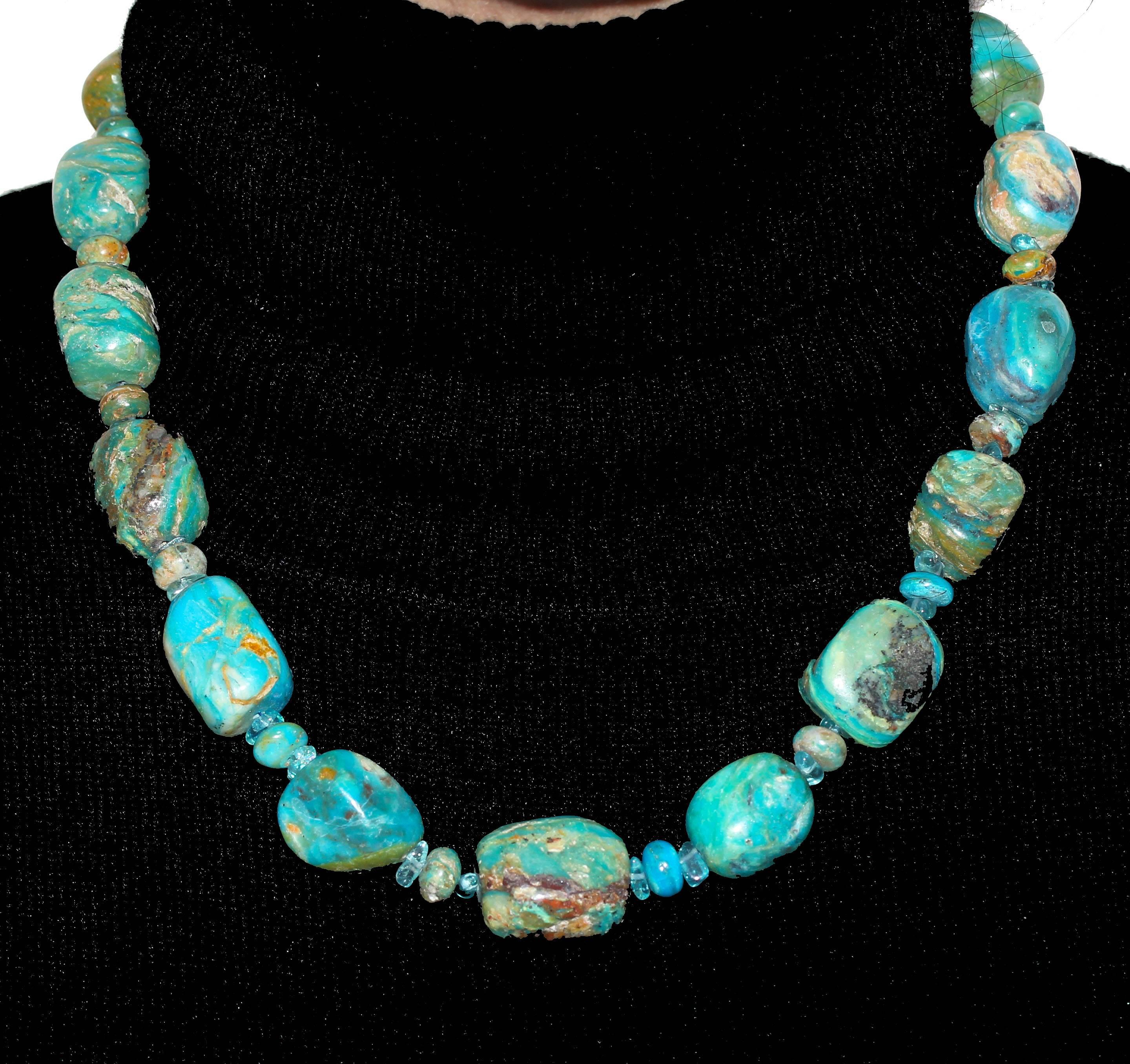 Naturally gently polished newly discovered exquisite blue real Peruvian Opals enhanced with brilliant blue natural Apatite polished chips.  It measures 19.5 inches long.  Magnificent on both white and black shirts for lunch, cocktails or dinner.
