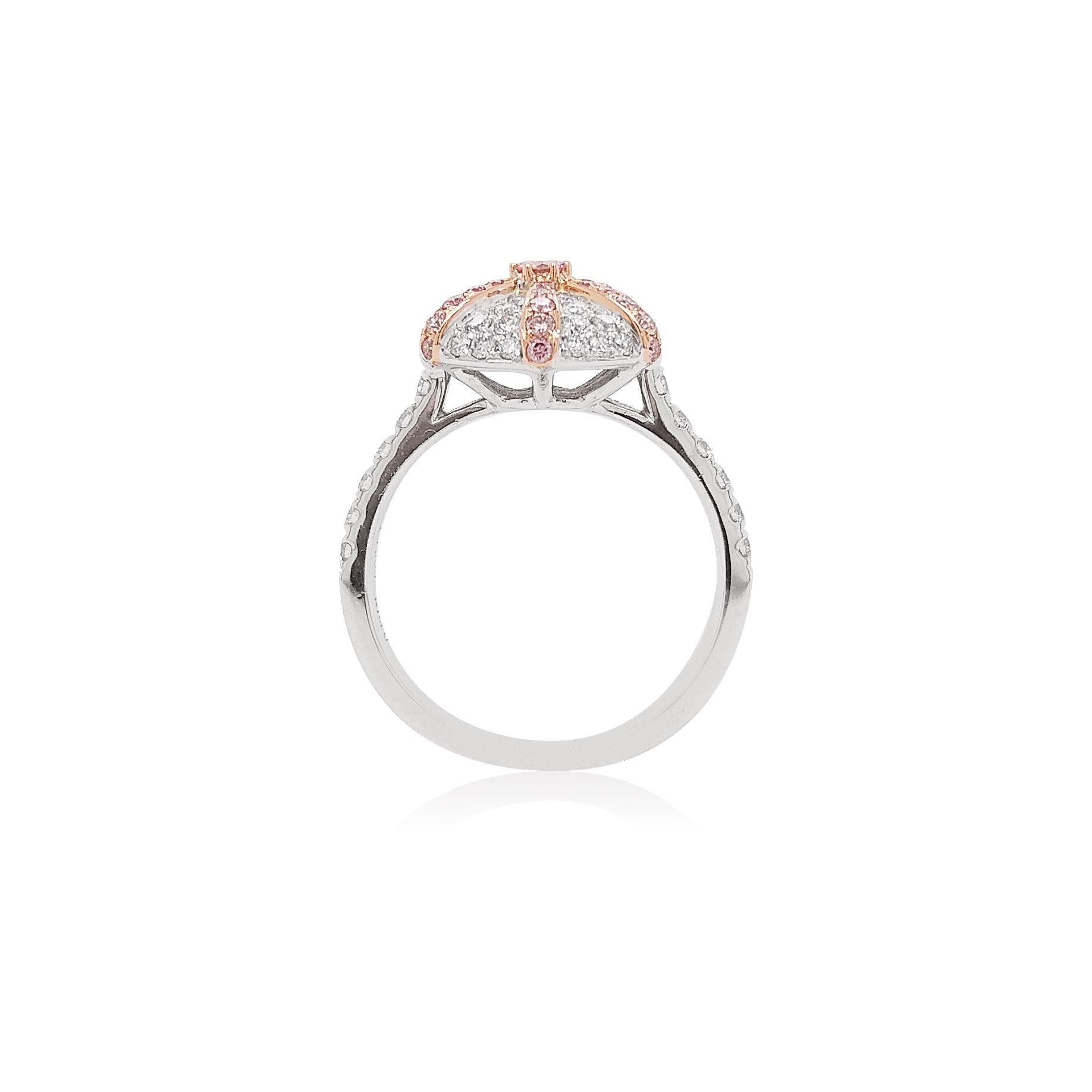 This contemporary Platinum ring features Argyle Pink diamonds at the forefront, surrounding an elegant arrangement of Pink and White diamonds formed into a star-shaped cluster. Modern and stylish, this ring will make a statement whenever and however