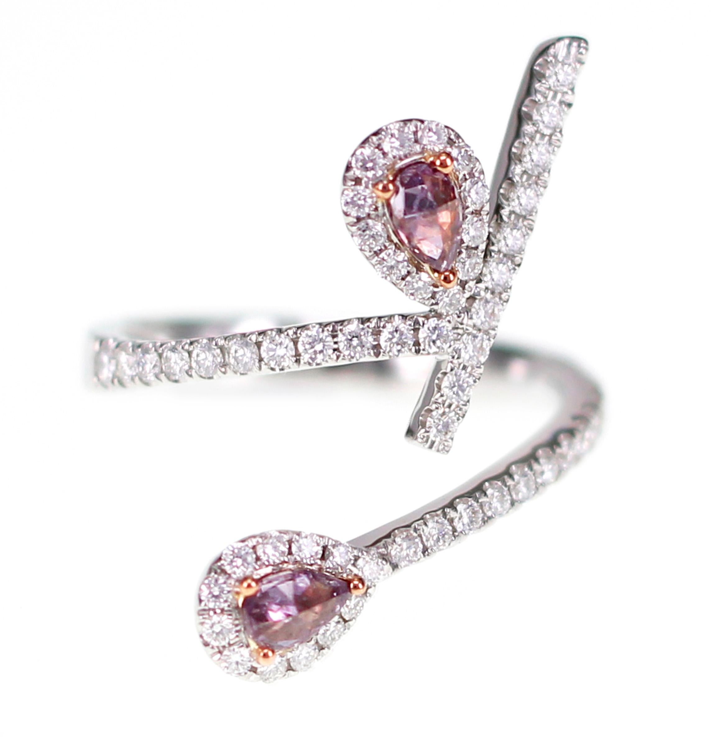 Natural Pink Diamonds from Argyle are set on a very chic twin ring. Pink diamonds weigh 0.25 carat and white diamonds weigh 0.5 carat. Pink Diamonds are rare and are in demand in recent times due to its investment value. 