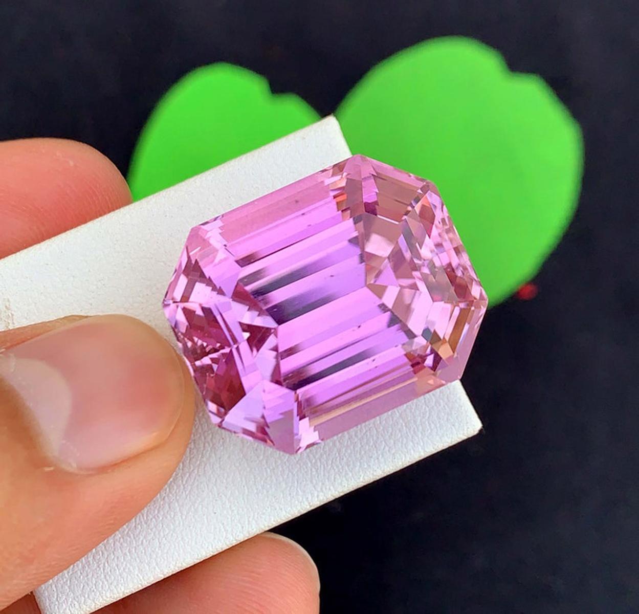 This Kunzite var. Spodumene gemstone bursts with an **electric-pink color** that instantly captures attention and radiates vibrant energy! Its refined **emerald cut** enhances every flash of brilliance, allowing light to glide across its crisp