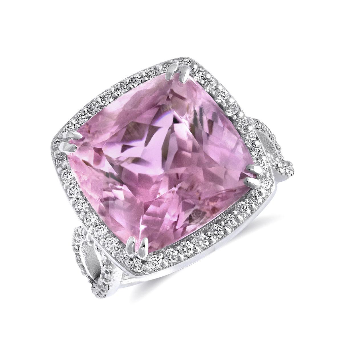 Indulge in the exquisite allure of natural kunzite with this stunning 14K white gold ring. Showcasing a breathtaking pink kunzite complemented by a halo of sparkling diamonds, this piece embodies elegance and sophistication. Perfect for adding a