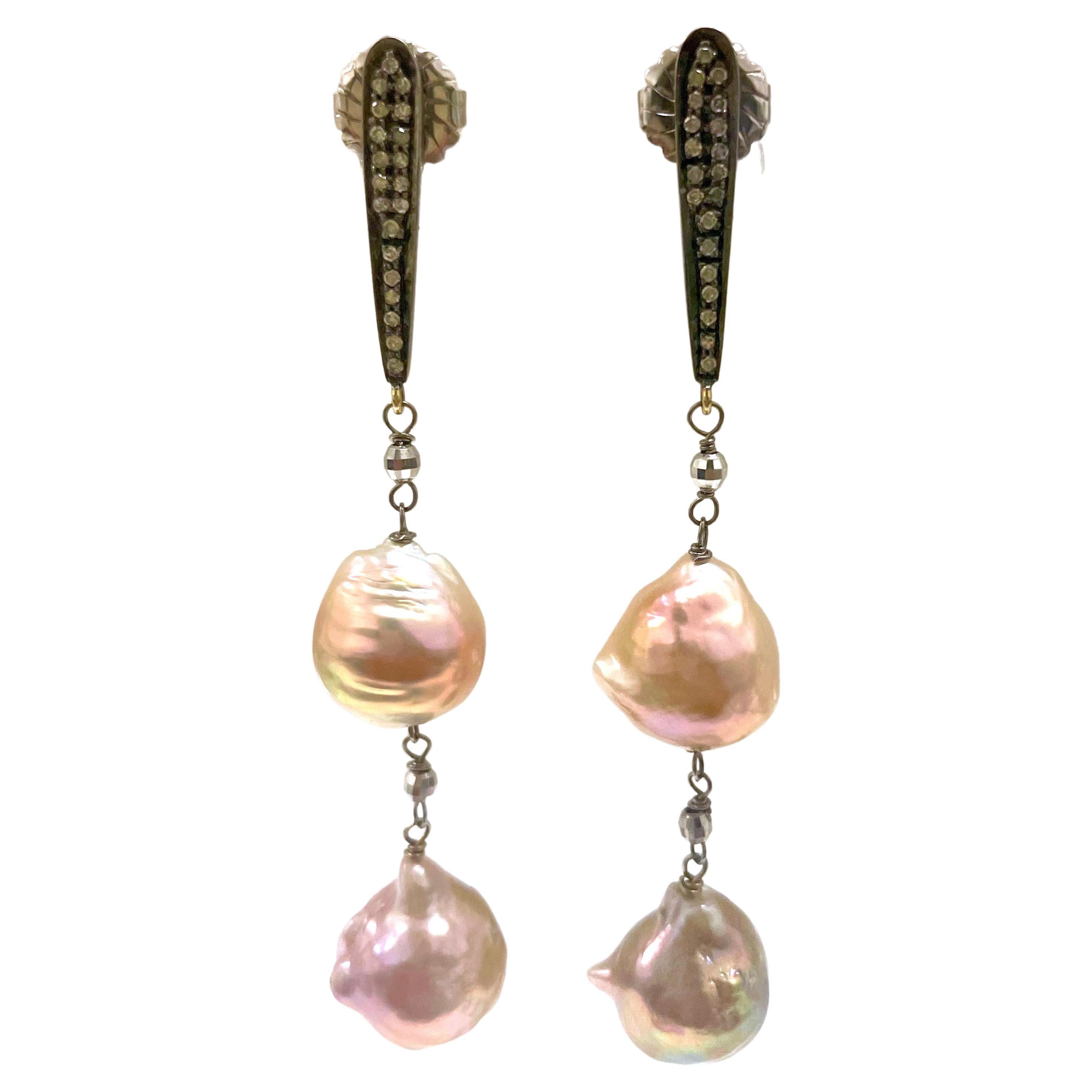 Description
Beautiful, large 13.5 to 14 mm, lustrous semi-baroque nucleated freshwater pearls in a unique
harmonized variation of natural pink hues suspended from pave diamond bar posts.
Item #E2924
Check out matching necklace, Item #N3316, and