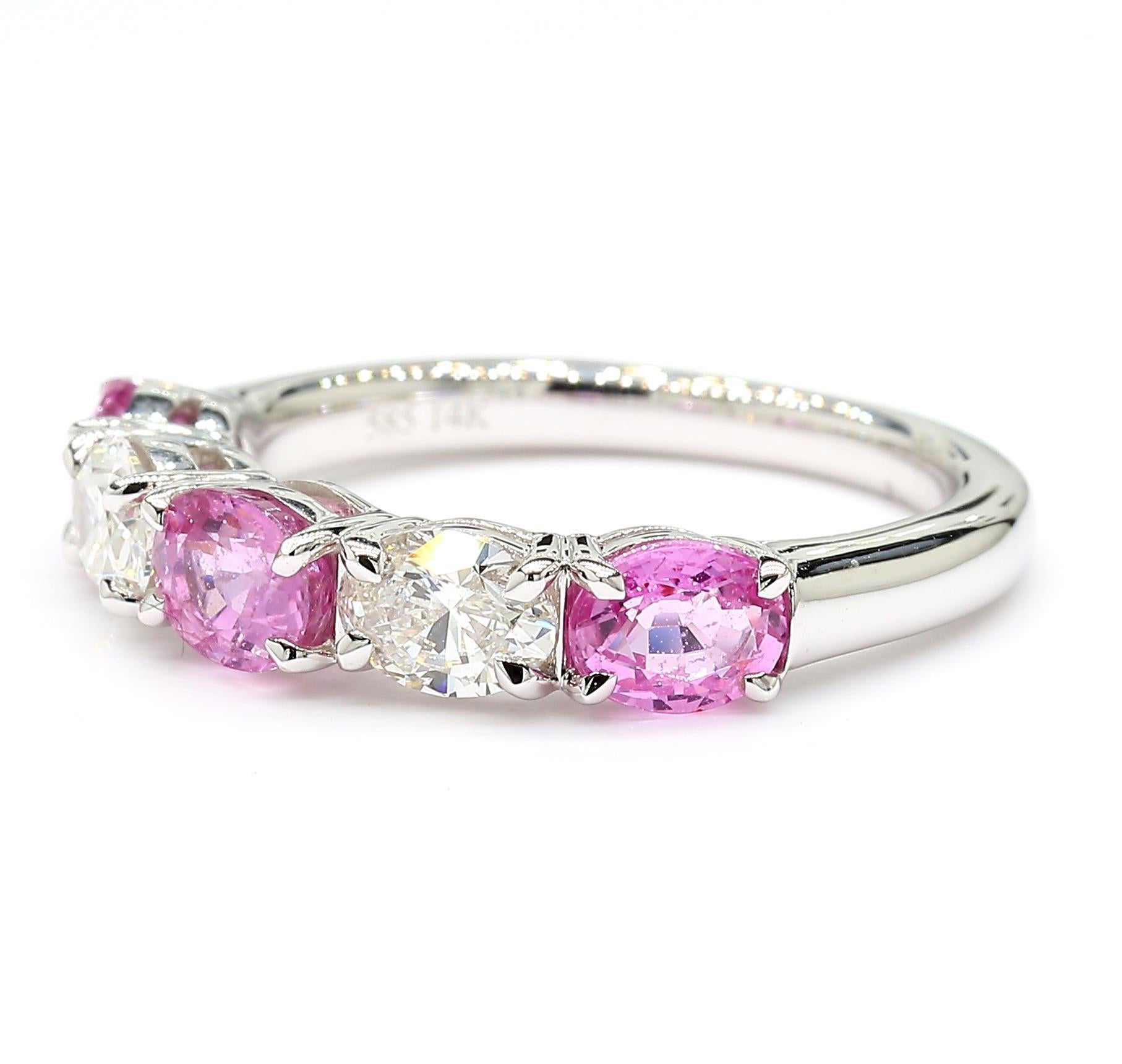 RareGemWorld's beautiful sapphire band. Mounted in a beautiful 14K White Gold setting with natural oval cut pink sapphires complimented by natural oval cut white diamonds. This band is guaranteed to impress and enhance your personal