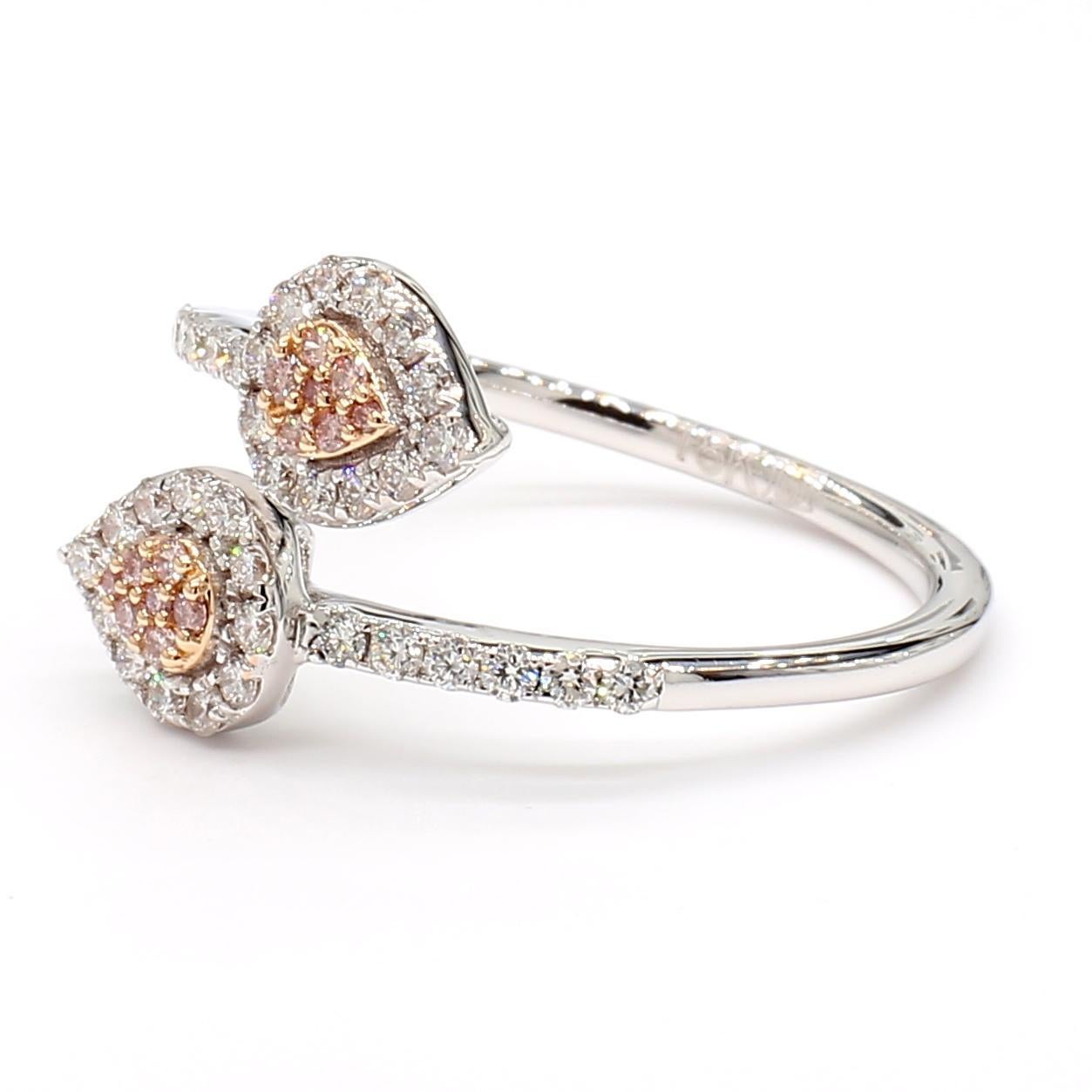 RareGemWorld's beautiful diamond ring. Mounted in a beautiful 18K Rose and White Gold setting with natural round pink diamond melee complimented by natural round white diamond melee. This ring is guaranteed to impress and enhance your personal