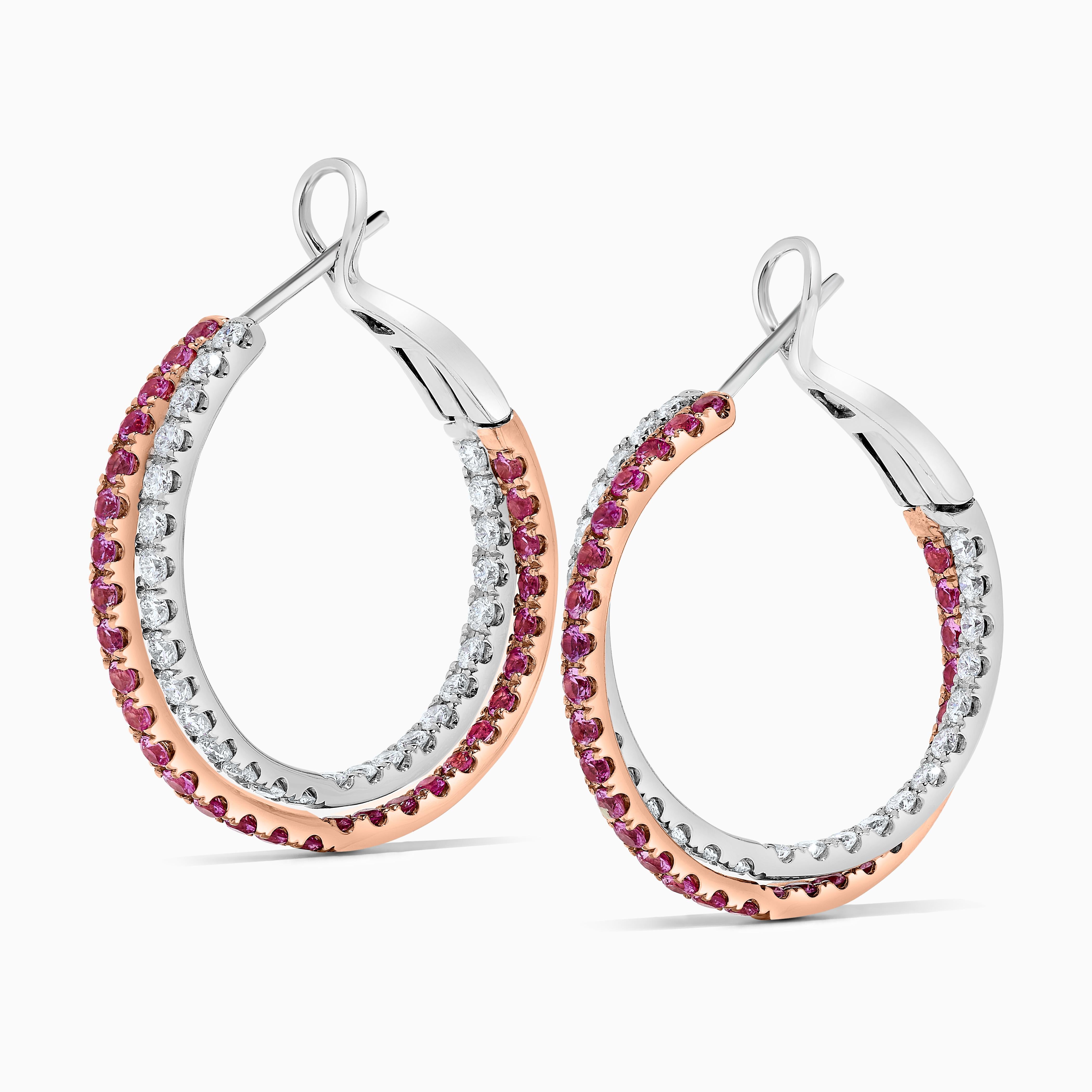 RareGemWorld's classic sapphire earrings. Mounted in a beautiful 14K Rose and White Gold setting with natural round cut pink sapphires. These earrings include both natural round pink sapphires and natural round white diamond melee in a beautiful