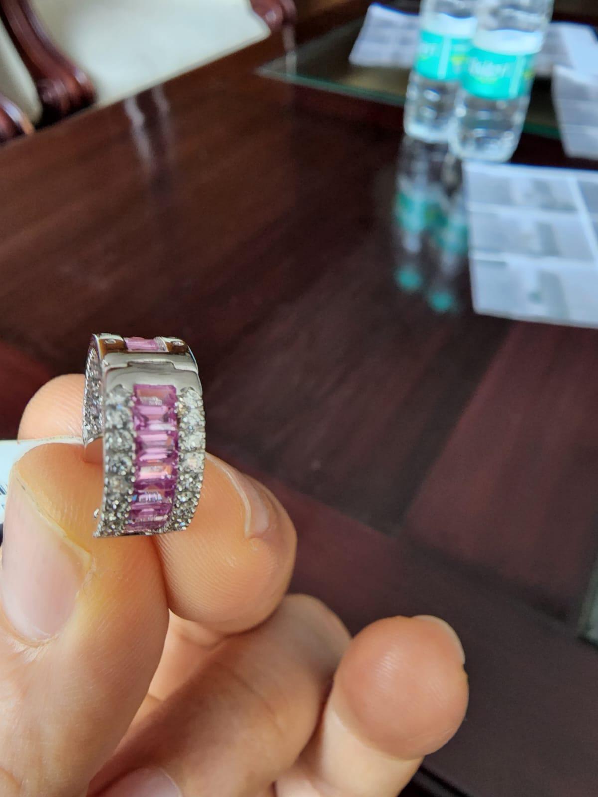 This is an amazing natural 0.96 carats diamond & pink sapphire 3.98 carats of Gold Weight is 7.08 gms (18k)

It’s very hard to capture the true color and luster of the stone, I have tried to add pictures which are taken professionally and by me from