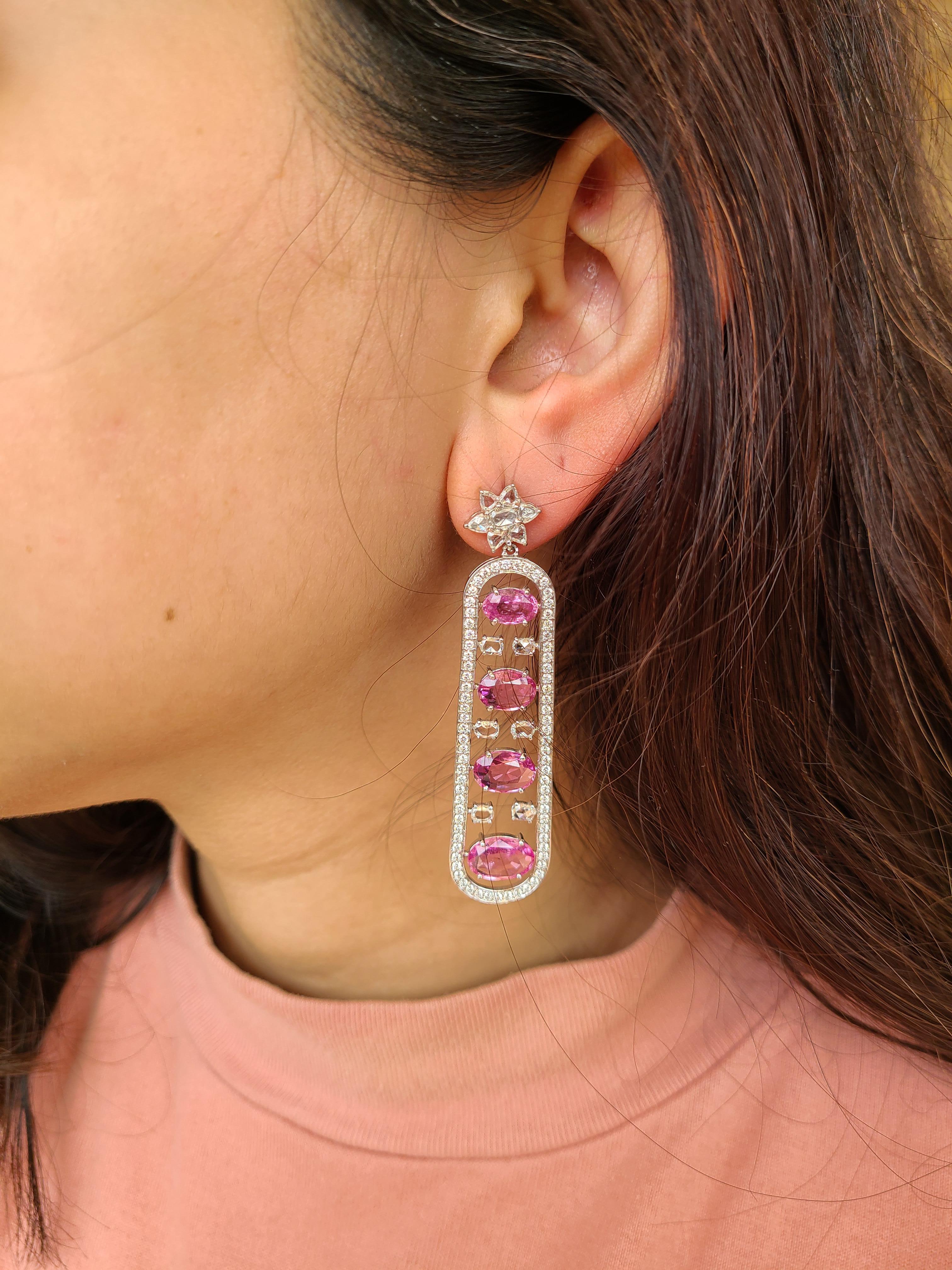 A beautiful and modern natural pink sapphire earrings set in 18k white gold with natural rose-cut and full cut diamond . The pink sapphire weight is 13.33 carats and diamond combined weight is 4.04 carats. The net gold weight is 15.946 grams and