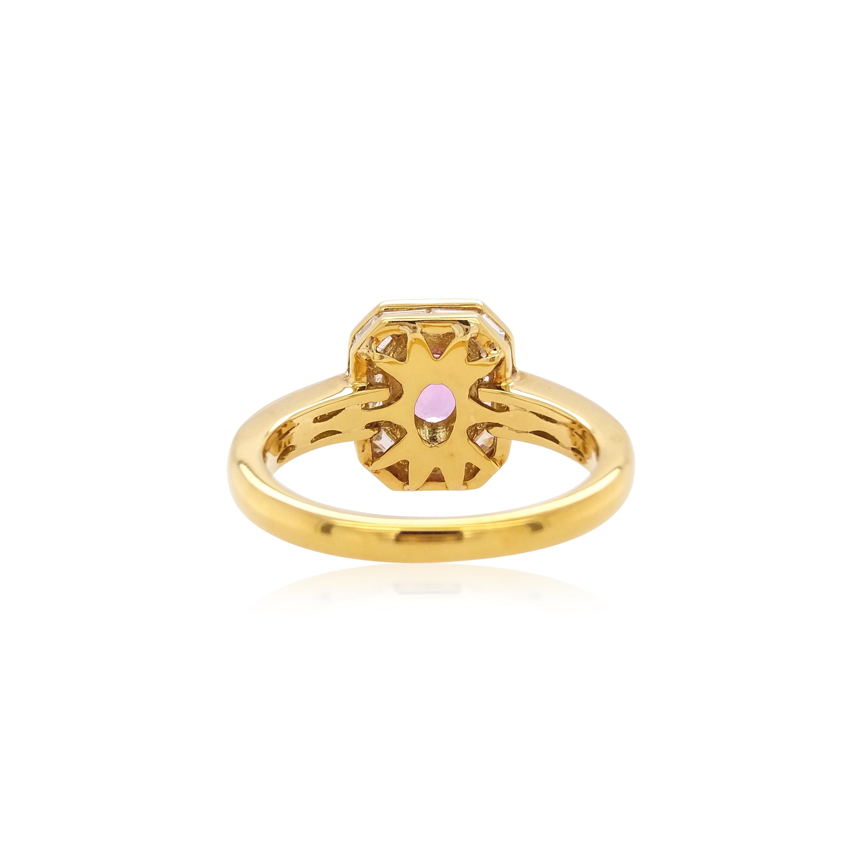 This graceful design captures the beauty of the spectacular oval-shaped pink sapphire by framing it in ornate arrangement of tapered-baguette diamonds set in 18K yellow gold. Bold and striking, this unique ring is the perfect statement piece. Each