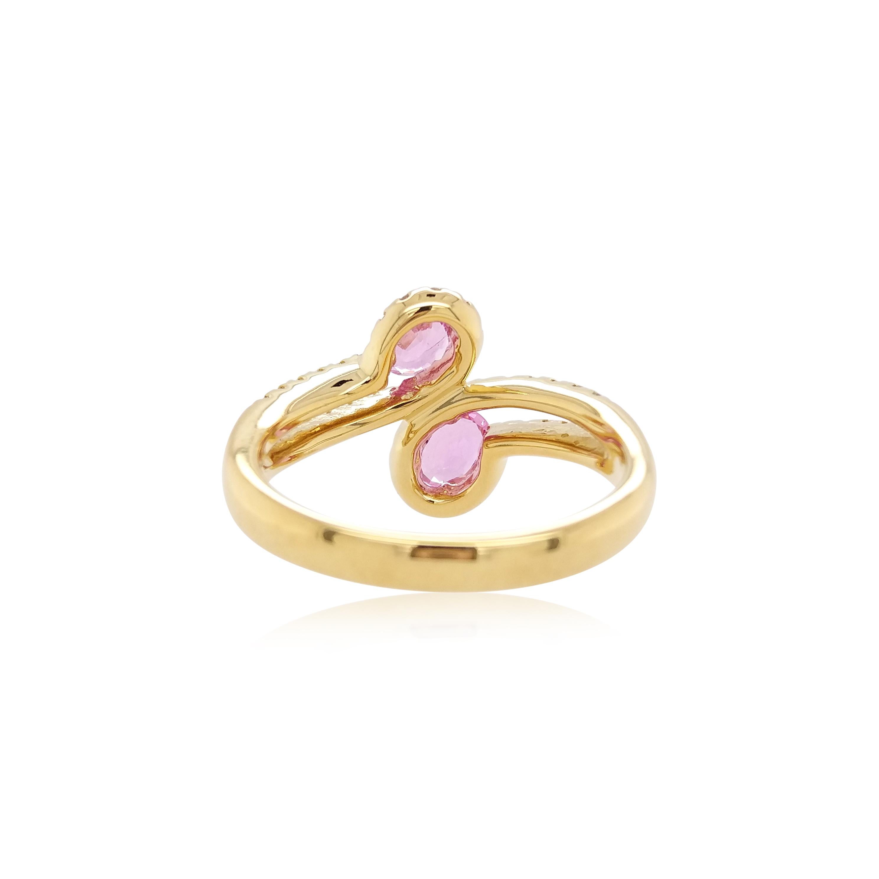 Beauty in the simplistic, this toi et moi ring is formed with two beautiful pink sapphires and elegant arrangement of scintillating white diamonds. Set in 18K yellow gold, dazzling and playful, this ring is a contemporary classic and will make the