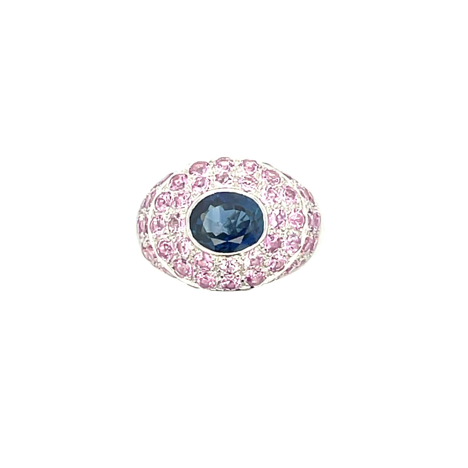 This gorgeous natural blue sapphire and natural pink sapphire pave ring in 18 kt white gold is the paramount of true elegance.

1 natural blue sapphire 2.22ct total weight

59 natural pink sapphires 3.62ct total weight

18kt white gold weighing 12