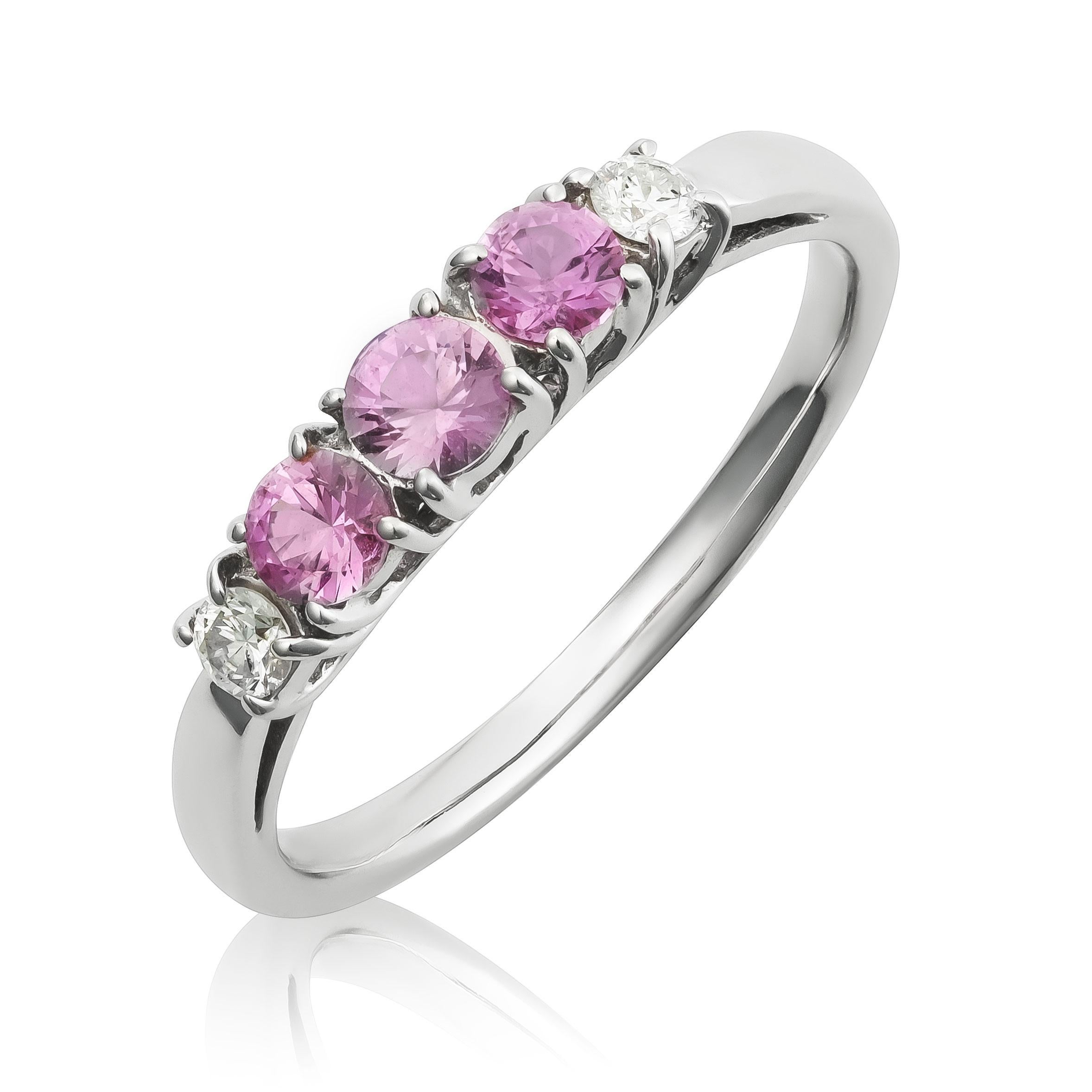 Discover the delicate elegance of this 18K white gold ring, featuring natural pink sapphires accented by sparkling diamonds. The soft pink sapphires, beautifully complemented by brilliant diamonds, create a refined and timeless piece perfect for any