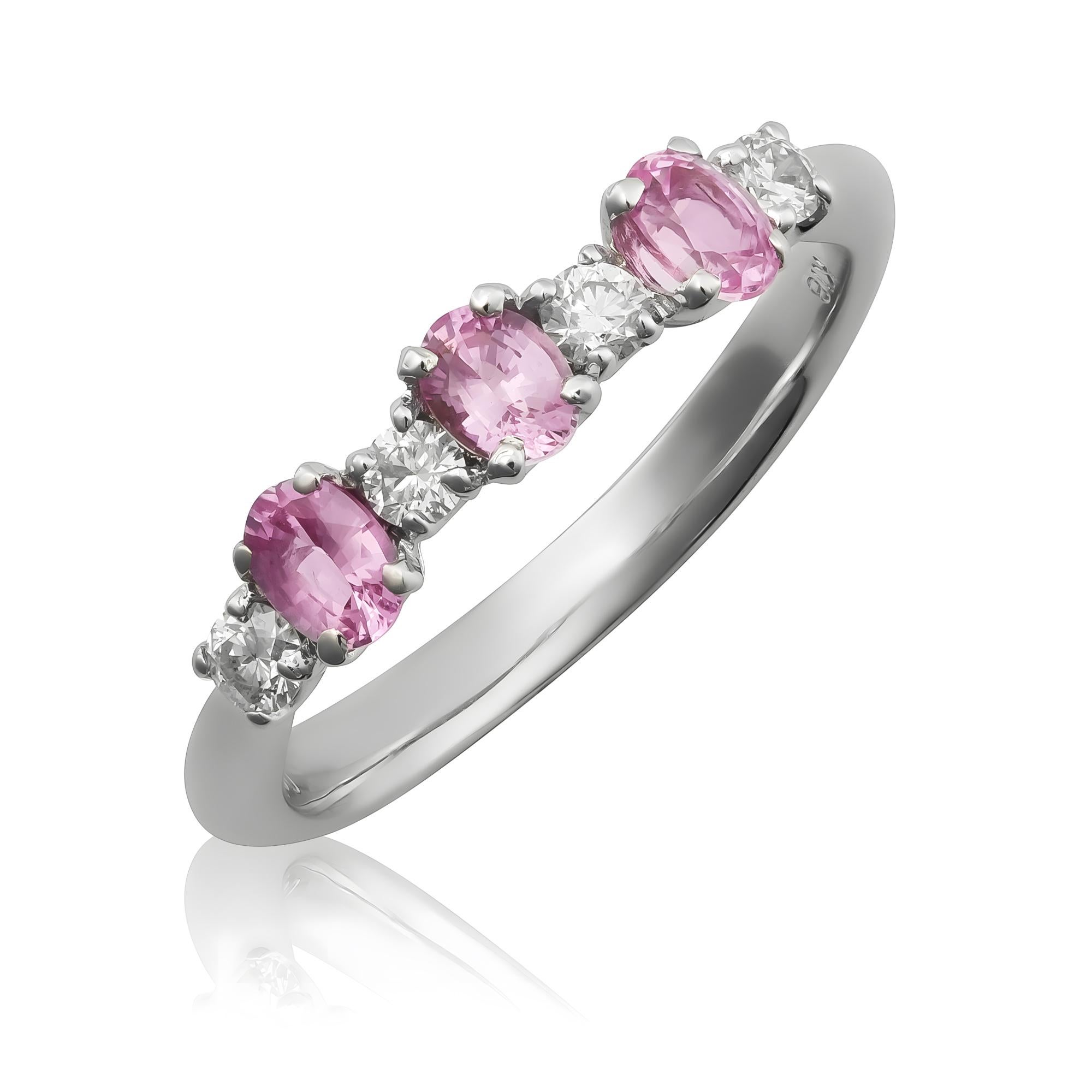 Discover the soft elegance of this 18K white gold ring, featuring natural pink sapphires accented by dazzling diamonds. The gentle pink sapphires, paired with sparkling diamonds, make this ring a beautiful choice for adding a touch of femininity and