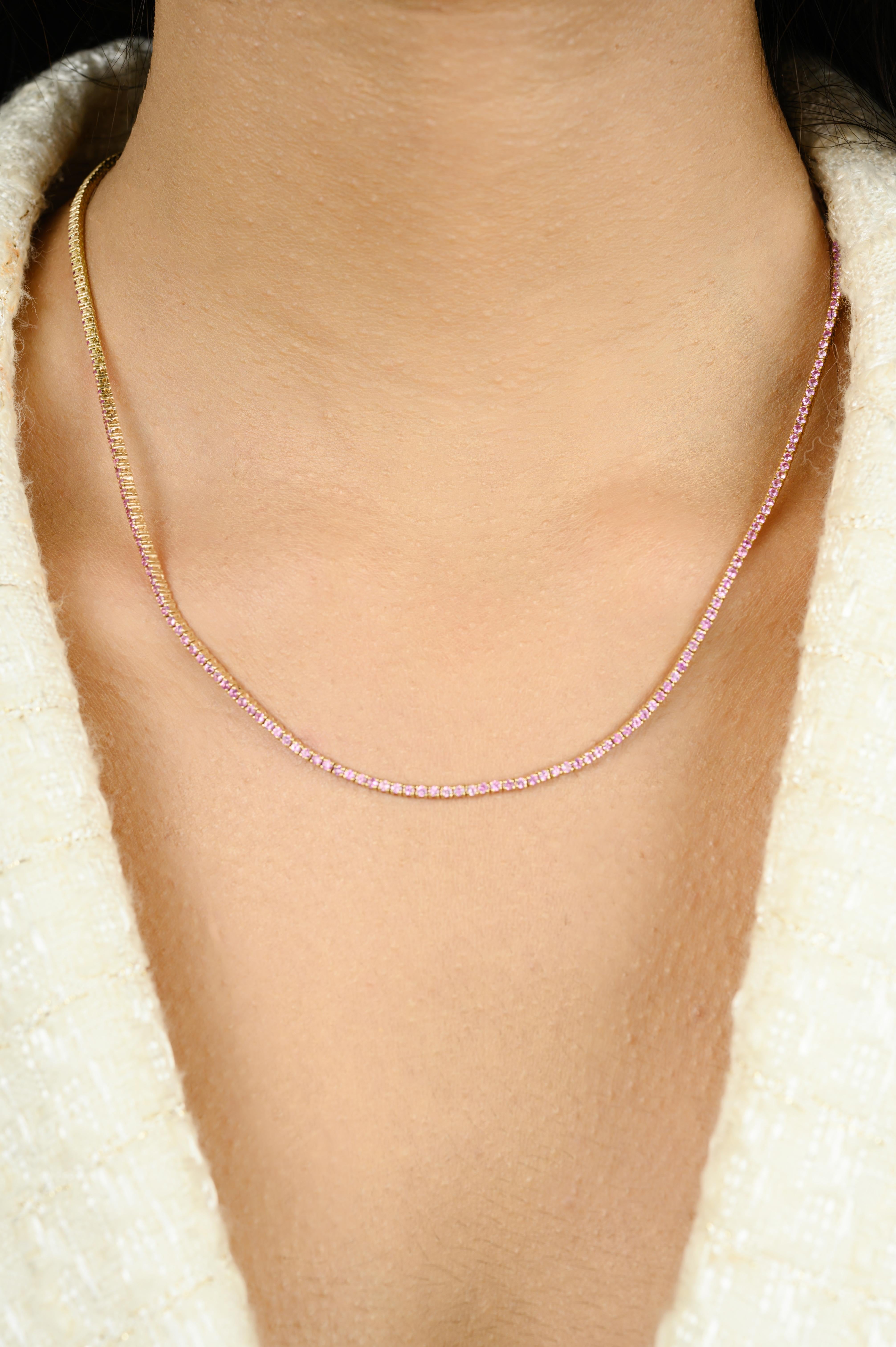 Natural Pink Sapphire Sleek Tennis Necklace Handcrafted in 14K Gold studded with round cut pink sapphire of 4.58 carats. This stunning piece of jewelry instantly elevates a casual look or dressy outfit. 
Sapphire stimulate concentration and reduces