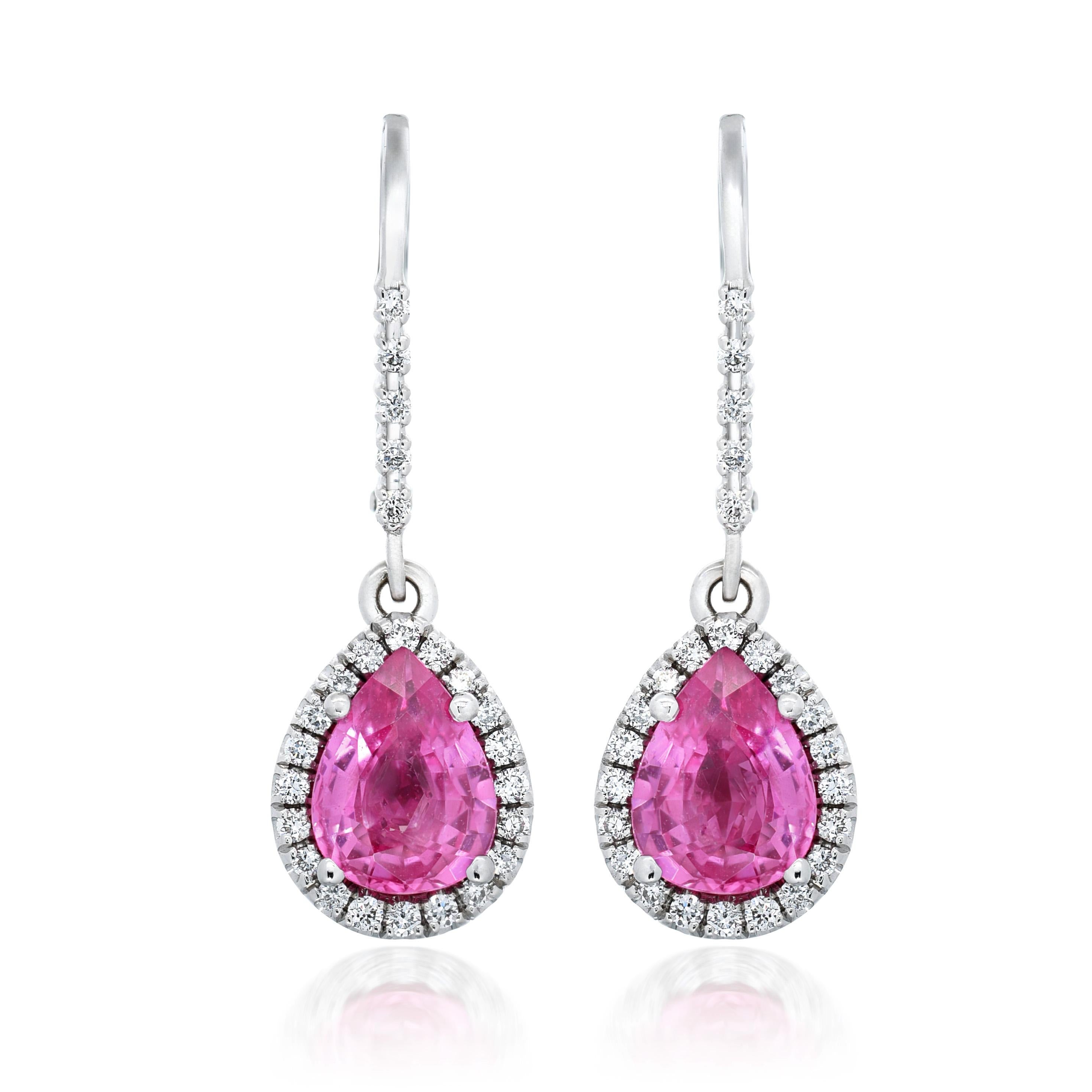 Discover the exquisite charm of natural pink sapphires, elegantly set in 14K white gold earrings. This stunning pair, complemented by sparkling diamonds, showcases the finest craftsmanship and the captivating beauty of these precious gemstones.