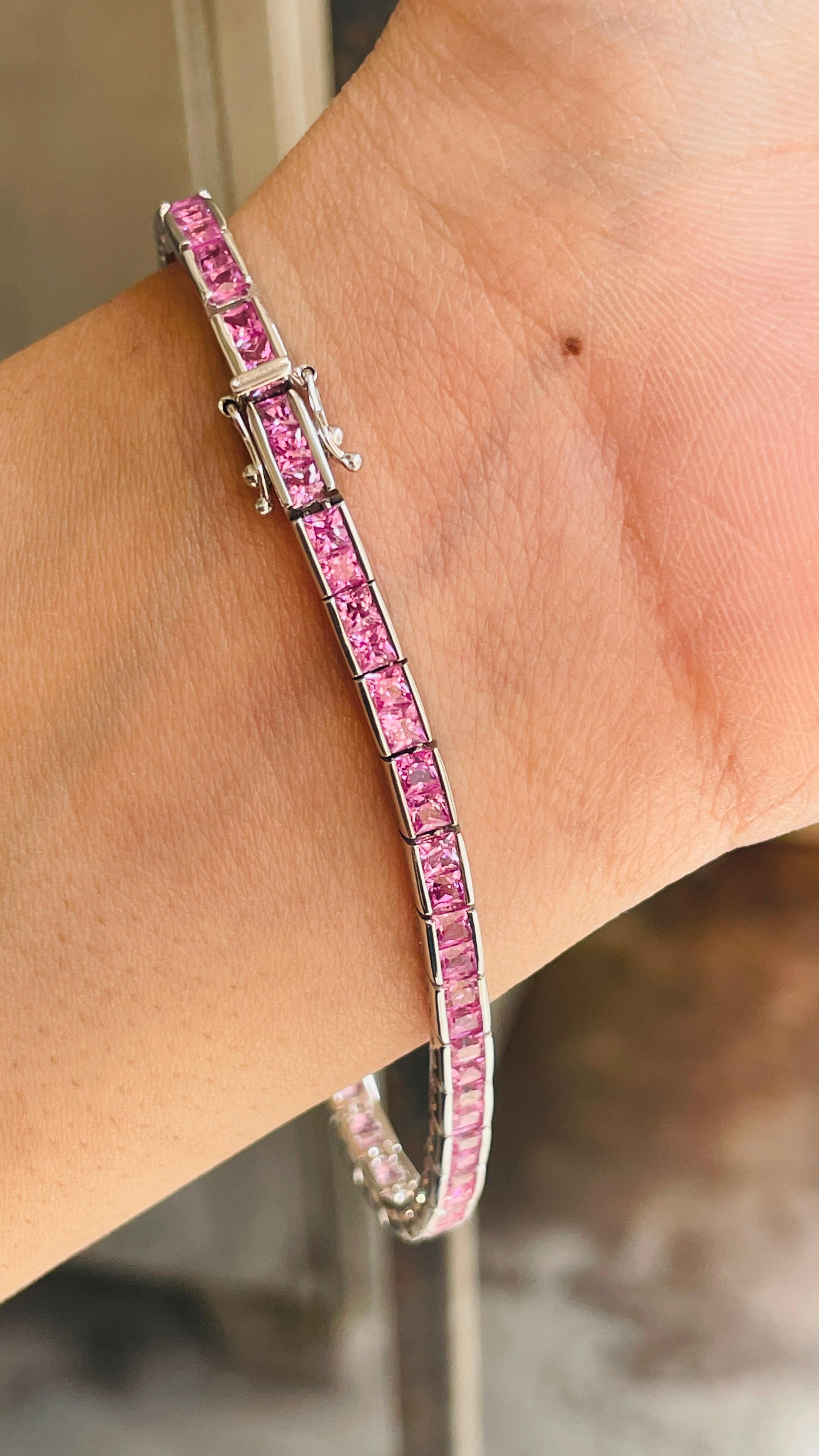 Pink Sapphire bracelet in 18K Gold. It has a perfect square cut gemstone to make you stand out on any occasion or an event. 
A tennis bracelet is an essential piece of jewelry when it comes to your wedding day. The sleek and elegant style
