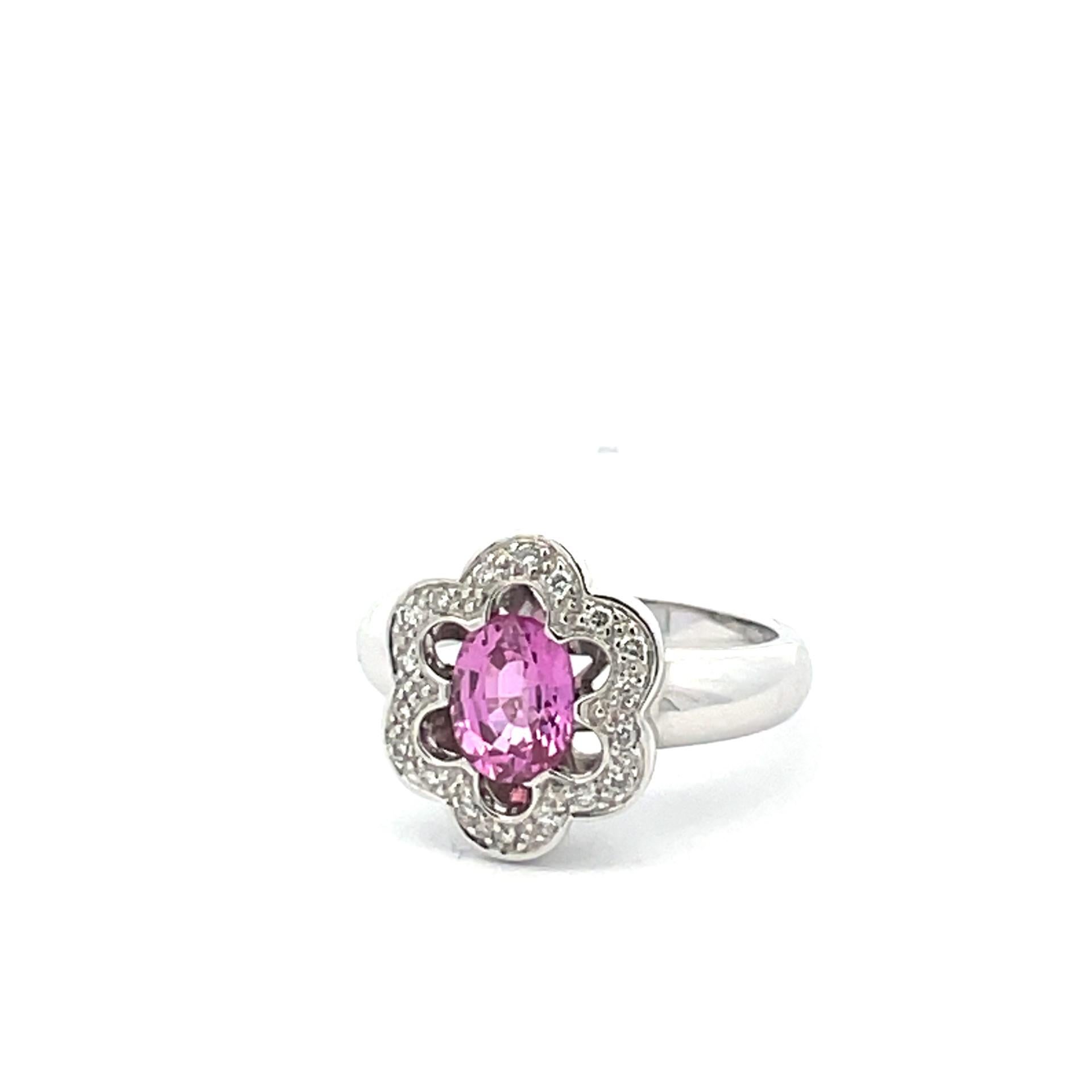 Blooming with sophistication this solitaire flower ring with natural pink sapphire center, natural white diamonds scalloped halo in 18kt white gold.

1 natural pink sapphire 1.52ct total weight

12 brilliant cut natural diamonds 0.84ct total